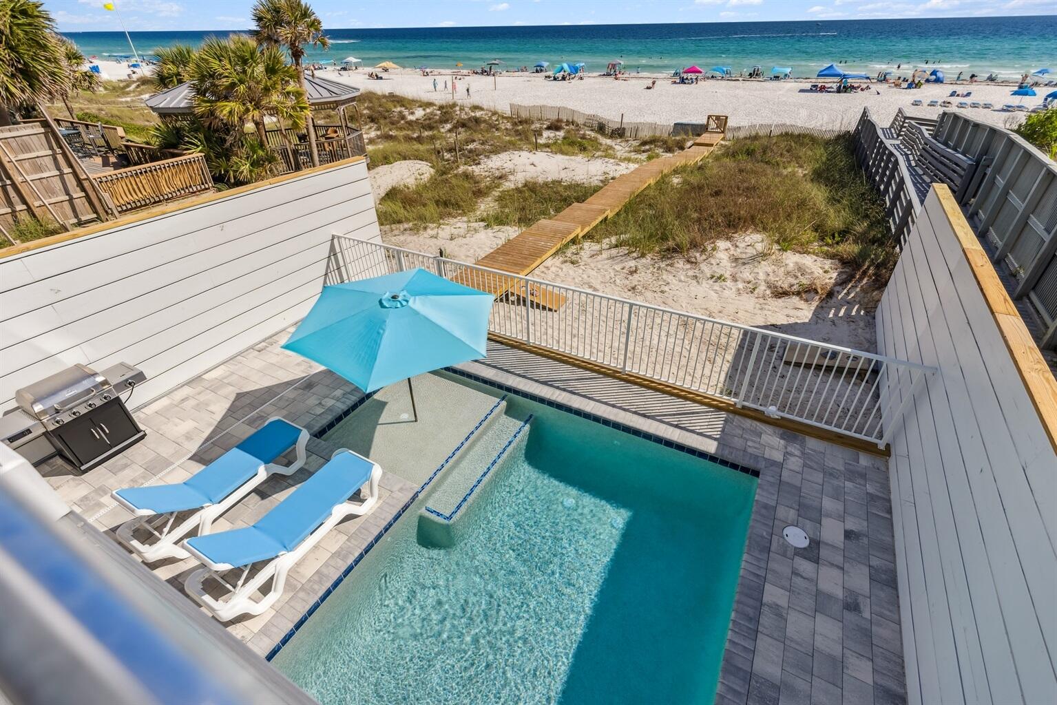 7 bedroom, 8.5 bath Gulf-front beach house in Panama City Beach with a heated private pool, parking for up to 9 vehicles, and no HOA restrictions. Built in 2025 and offered fully furnished, the home combines direct beachfront living, large gathering spaces, and high-end finishes for buyers seeking a luxury second home, private retreat, or income-producing property. The property has more than $200,000 already booked for 2026 and is projected to generate up to $400,000 annually.

The main living area features an approximately 30 x 30 open layout designed for large groups, with Gulf views from nearly every angle. The chef's kitchen is centered around a 10 x 5 island with granite slabs imported from Brazil, dual refrigerators, wraparound seating, and a 75-inch wall-mounted TV. The home also includes 12 smart TVs, a 412-game arcade console, and a third-floor entertainment lounge with space for movie nights, games, a pool table, or air hockey. The primary suite includes 16-foot ceilings, chapel windows overlooking the Gulf, and a private lounge area with a coffee and wine bar.

Freshly styled with more than $150,000 in designer furnishings, accessories, and custom window treatments, the home delivers a turnkey Gulf-front experience. Hurricane-impact windows, a 10-foot sliding glass door, and triple-pane Therma-Tru doors are designed to capture the views while adding protection from coastal weather. A commercial-grade fire suppression system with 24-hour monitoring adds another layer of safety throughout the home and outdoor spaces.

Outdoor living is a major feature, with an approximately 30 x 25 beachfront deck overlooking a heated 12 x 23 Gulf-front pool with an 8 x 6 sun shelf and two heaters. A powder-coated aluminum safety fence helps secure the pool area without blocking the Gulf view, and reinforced balcony railings provide added peace of mind. The lot extends all the way to the wet sand, creating a rare stretch of usable beachfront directly behind the home. There is also room for jet skis and other beach gear.

Seller states this is the first beachfront home on Panama City Beach built on 12 x 12 concrete pilings driven 20 feet deep rather than traditional wood pilings. The exterior also features Hardie Board siding secured with stainless screws and a rust-resistant aluminum roof designed to last 30 years or more. Located minutes from Pier Park and near the soon-to-open Tootsies, Top Golf, and Dolly Parton's Pirates Voyage. Buyer to verify all dimensions, bookings, income projections, and future development timelines.