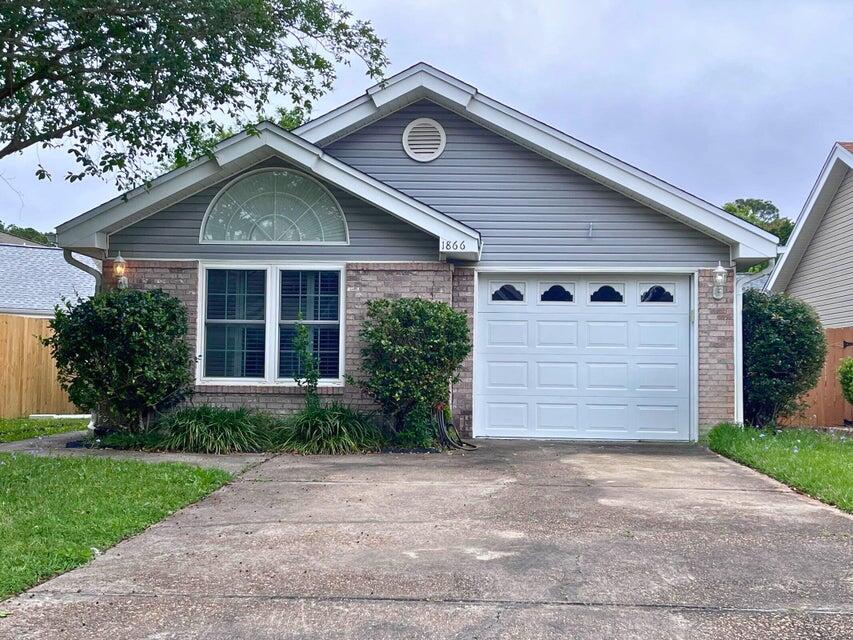 Perfect location and close to both military bases. This well cared for home features a split bedroom floor plan, vaulted ceilings and a gas fireplace; with carpet in the living room and dining area. Tiled kitchen with a breakfast bar. All bedrooms have wood flooring. French doors open up from the dining room to the back yard.