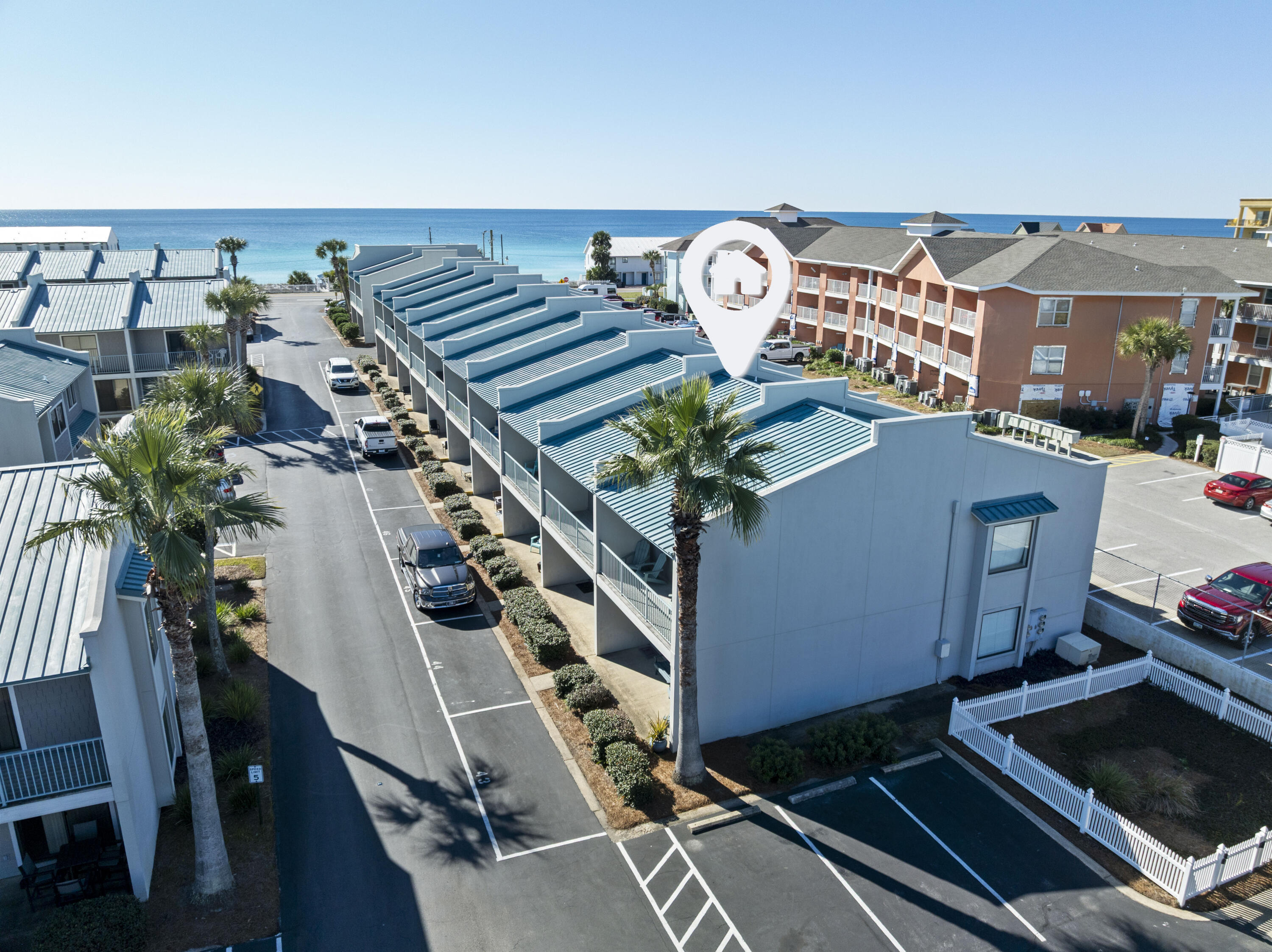 Complete, beautiful renovation—this turnkey, furnished, rental-ready townhome is just steps from the beach. Fully updated with new flooring, kitchen appliances, cabinets, quartz counter tops, sinks, plumbing and light fixtures. Bathrooms feature new tile showers, glass doors, vanities, and toilets. Popcorn ceilings removed and repainted; all trim, interior doors, and hardware replaced. This two-level, 2-bedroom, 2.5-bath unit in desirable Gulf Winds East offers private deeded beach access with a Gulf-front gazebo, a heated community pool, and Gulf views from both balconies. Public beach access is directly across the street. Ideal as a second home or investment property in a prime coastal location.