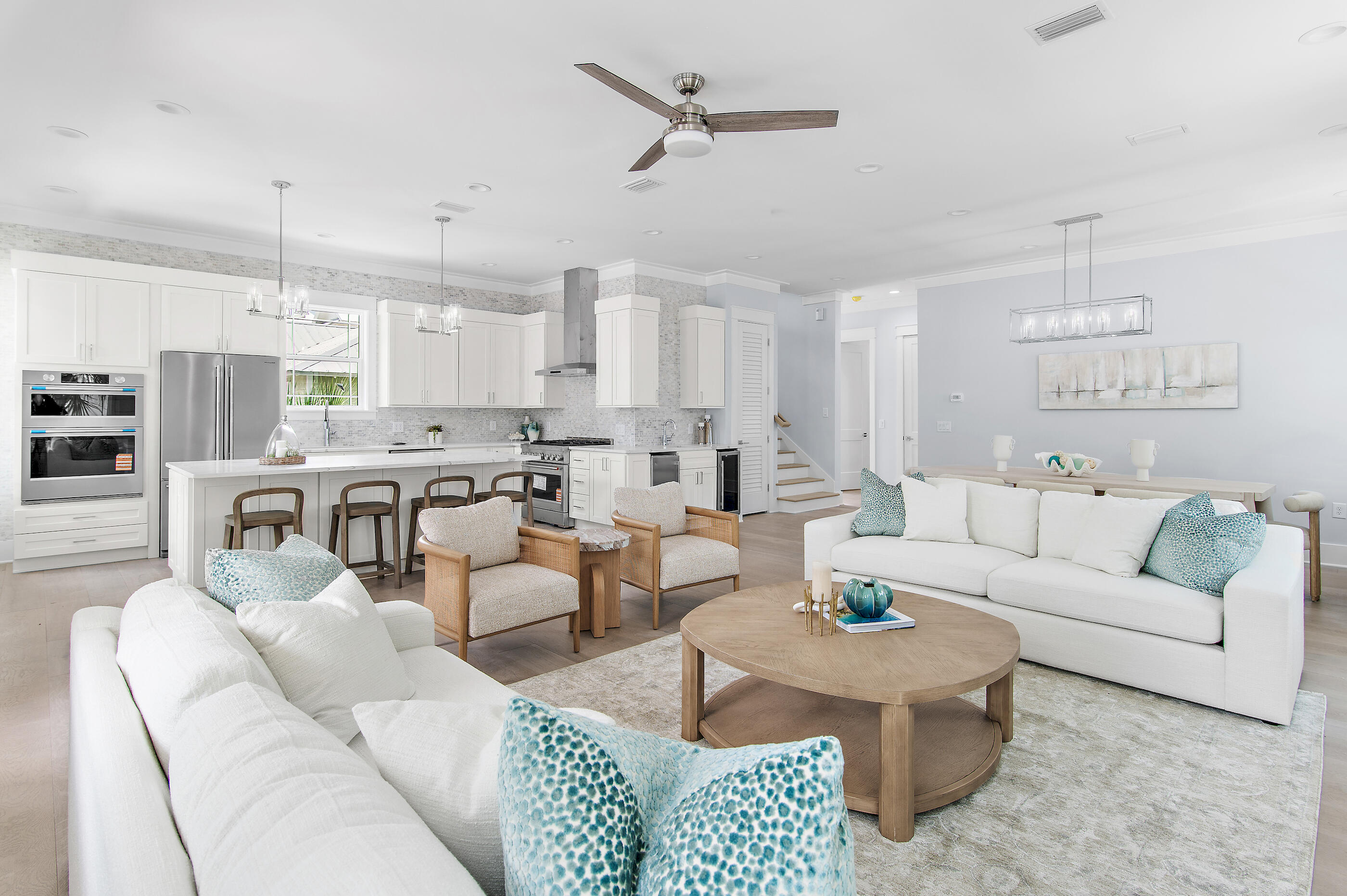 Located in the highly sought-after community of Seacrest Beach along scenic Hwy 30A, this exquisite newly constructed beach house is a true coastal retreat, offered fully furnished and ready for immediate enjoyment. Featuring 5 spacious bedrooms and 5.5 luxurious bathrooms, the home seamlessly blends comfort and elegance with beautiful 9-inch-wide plank engineered wood flooring throughout. The thoughtfully designed layout includes two primary suites--one conveniently located on the first floor and another on the third floor--providing privacy and comfort for family and guests alike. With two inviting living areas, the main gathering space on the first floor serves as the heart of the home and features a striking 72-inch three-dimensional electric fireplace that adds warmth and modern ambiance.

The second floor offers an additional living area along with a spacious covered outdoor living space, perfect for entertaining or enjoying the coastal breeze. At the center of the home, the open-concept kitchen impresses with modern shaker-style cabinetry, elegant quartz countertops, a gleaming tile backsplash, and high-end appliances designed to please any culinary enthusiast. Just outside the kitchen, a beautifully designed wet bar with open wood shelving, a wine refrigerator, and an ice machine creates the perfect setup for entertaining.

Comfort and efficiency are thoughtfully incorporated throughout the home, including a Rinnai 11.5 GPM super high-efficiency tankless water heater to ensure endless hot water, as well as a washer and dryer included for convenience.

Enjoy fresh air and peaceful views from the porches attached to three of the five bedrooms, along with two expansive porches located off the first-floor. For easy beach access, the Seacrest Beach shuttle conveniently stops right outside your door, offering a quick ride to the beautiful Gulf waters.

Start your mornings with breakfast at a charming neighborhood café or explore the nearby dining, boutique shopping, and entertainment options just a few blocks away in Rosemary Beach and Alys Beach. Spend your days strolling along the world-famous white-sand beaches, fishing along the coast, or teeing off just minutes away at Camp Creek Golf Club. Nature lovers will also appreciate the nearby Camp Helen State Park, where you can enjoy birding, hiking, kayaking, and fishing on the peaceful waters of Lake Powell.