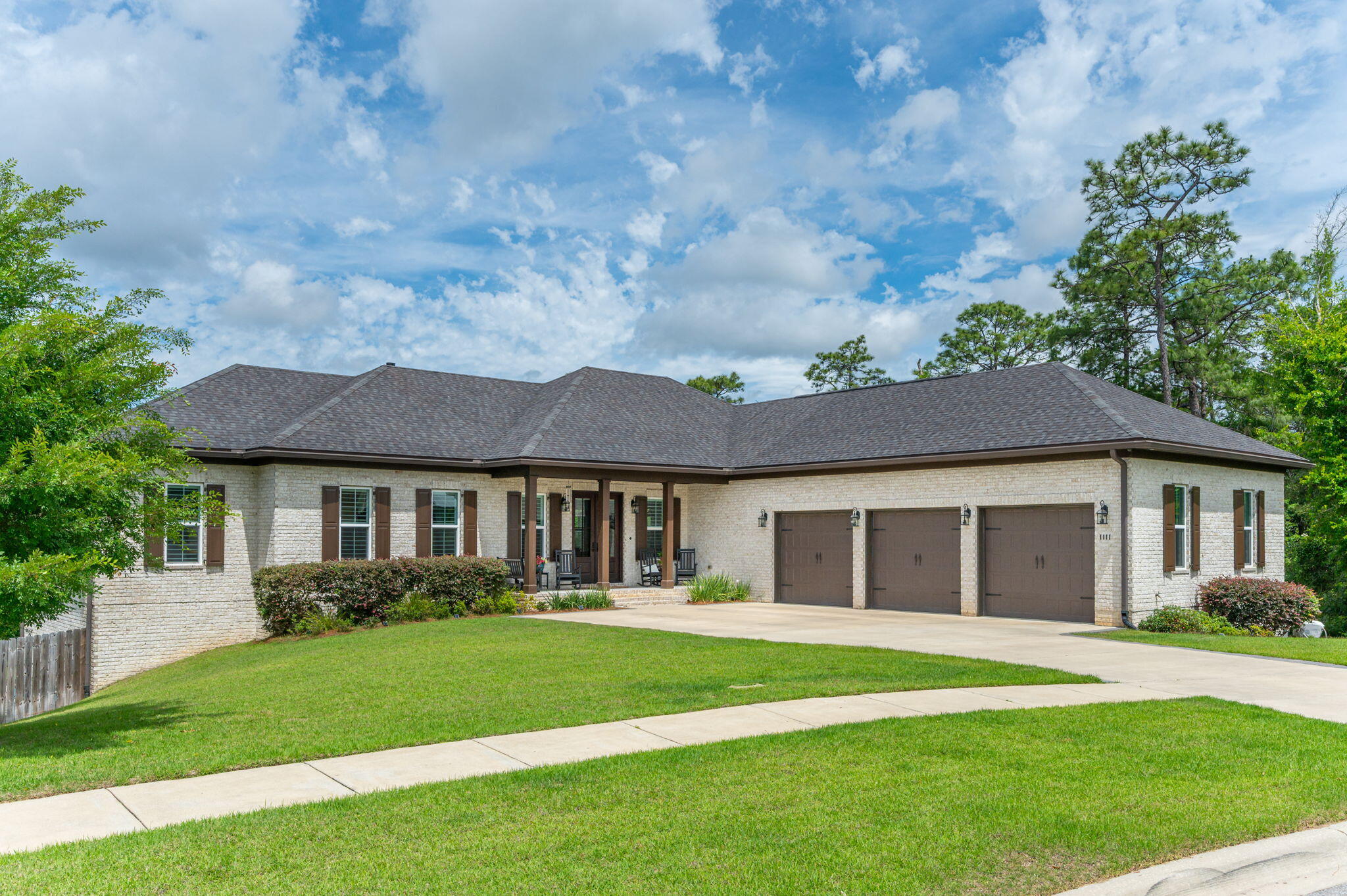 Not every address in Deer Moss Creek is created equal. This home sits apart -- literally and by design. Positioned on one of the community's largest lots this home is flanked on two sides by PERMANENT CONSERVATION LAND. There is no neighbor to the right. There is no development planned behind you. What exists instead is something increasingly rare in master-planned communities -- genuine privacy, undisturbed nature, and a VIEW of native woodland that changes beautifully with every season and every evening sky. The home is organized around that setting. On the main floor, the master suite, great room, and kitchen are arranged with an easy, open logic -- spaces that connect naturally and orient toward the conservation rather than away from it. The walk-out lower level extends the home's livability in a different direction: a PRIVATE POOL at the base of the yard, a dedicated FITNESS CENTER, generous recreation space, and covered OUTDOOR LIVING that makes the transition between inside and outside feel seamless. It is the kind of space a family quietly claims as their own. A WHOLE HOUSE GENERATOR provides resilience without compromise. Move-in ready condition means the home is available now -- without the timelines, contingencies, and uncertainty that accompany new construction at this price point. Deer Moss Creek is Niceville's defining community -- top-rated schools, nature trails, and a location that places Eglin AFB, Hurlburt Field, and the white sandy beaches of the Emerald Coast within easy reach. Lots of this size and position no longer come to market in Niceville or Deer Moss Creek. Simply put, this home is one that cannot be replicated.