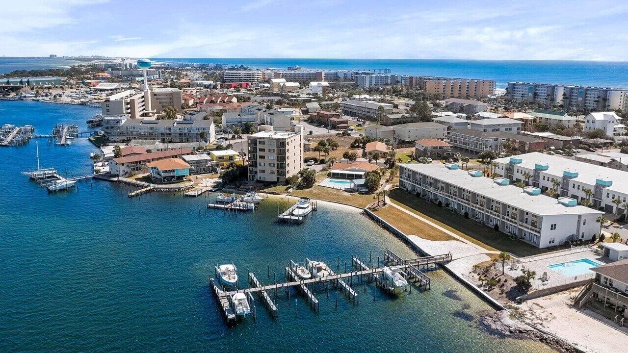 Check out this immaculately kept waterfront townhome in the highly desired Soundside Lofts community on Okaloosa Island.

This 3BR/3BA + bunk room home offers unobstructed Sound views and its own deep-water boat slip with a 12,000 lb lift accommodating boats up to 32 ft. Features include luxury vinyl plank flooring throughout, custom closet shelving, 5-panel doors, shaker cabinets, craftsman trim, and impact-rated windows and doors. 

The kitchen boasts stainless steel appliances, granite countertops, and stunning water views from both levels. Community amenities include a pool with sundeck and a private dog park. Located just a 3-5 minute walk to the white-sand beaches of the Emerald Coast and a short boat ride to Destin Harbor and Crab Island. Turn-key and ideal for a primary residence, second home, or investment property. Schedule your showing today