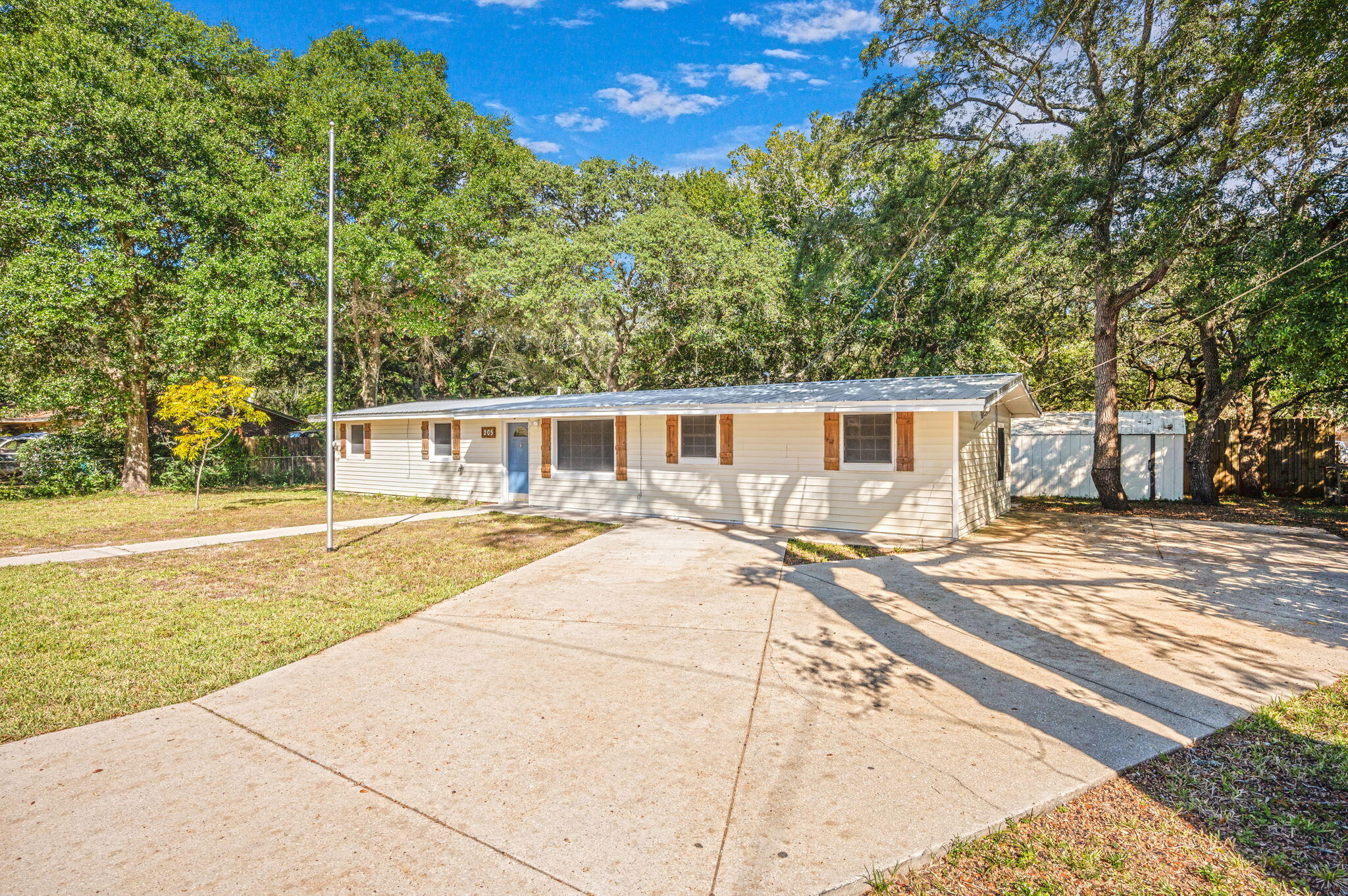 STOP settling for overpriced homes with old roofs and surprise repair lists. This Fort Walton Beach home comes out SWINGING with a metal roof installed June 2025  and Clean, functional, full of natural light, and sitting on a spacious yard with room for entertaining, storage, pets, projects, or future expansion. Whether you are a first-time buyer, military relocation, or investor looking for a smart buy without the drama -- this one checks boxes FAST. Affordable homes with BIG updates are disappearing from the market. Blink and this one will be gone. Lucky YOU. 🍀