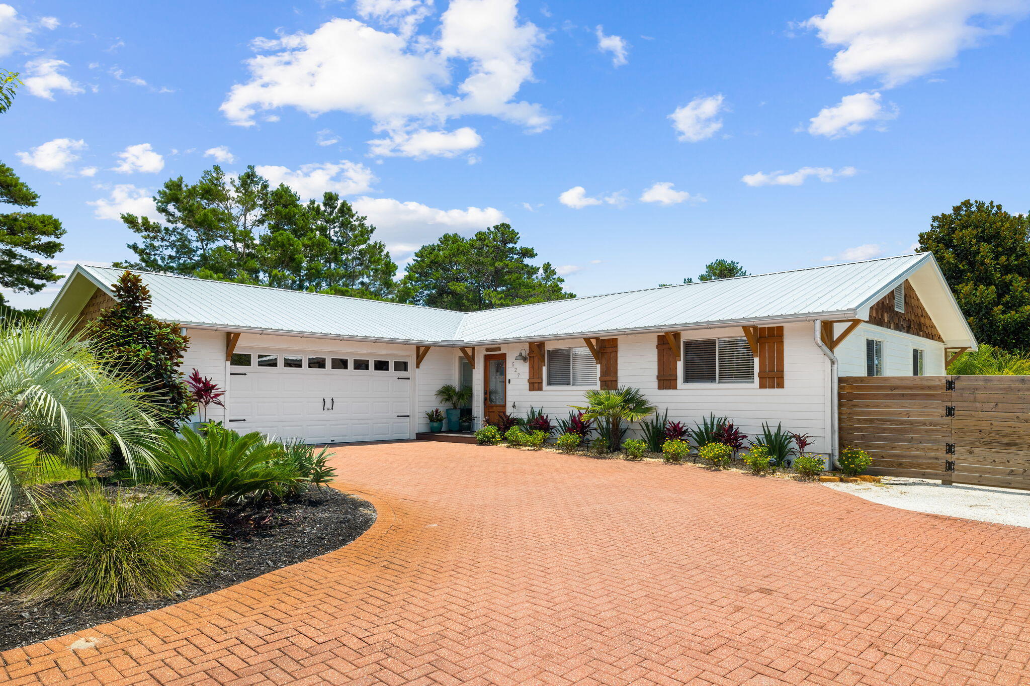 Half a mile from the Gulf and sitting on a rare 1/3-acre lot with no HOA, this is your canvas for a private coastal oasis -- and the heavy lifting is already done. Welcome to Santa Rosa Ridge, one of the West End of 30A's best-kept secrets. This 3-bedroom, 3-bath coastal cottage (with flex space) is offered fully-furnished and fully reimagined with a complete remodel down to the studs in 2016. The whole house renovation included: new electrical, plumbing, whole-home tankless water heater, full attic and wall insulation, drywall, AC ductwork with two added returns, new roof, moisture barrier, and exterior siding. Inside, a designer kitchen was reimagined and features quartz countertops, stainless appliances, open shelving, and an oversized island. Three bathrooms were fully renovated with new cabinetry and luxury tile added throughout. The primary ensuite is a calm retreat with a private bath, barn doors, and a mid-century modern warmth. Two additional guests rooms share access to a spacious hallway bath with glass enclosed shower. The attached garage offers exceptional flexibility -- currently configured as a private guest suite or lock-out apartment with a mini kitchenette and full bath, ideal for multi-generational living or hosting. Outside is where the vision comes to life with an oversized deck and room to add a custom pool or detached carriage house, this private oasis is perfect to relax and enjoy after a long day at the beach. Half a mile from the Gulf and sitting on a rare 1/3-acre lot with no HOA, this is your canvas for a private coastal oasis -- and the heavy lifting is already done. Welcome to Santa Rosa Ridge, one of the West End of 30A's best-kept secrets. This 3-bedroom, 3-bath coastal cottage (with flex space) is offered fully-furnished and fully reimagined with a complete remodel down to the studs in 2016. The whole house renovation included: new electrical, plumbing, whole-home tankless water heater, full attic and wall insulation, drywall, AC ductwork with two added returns, new roof, moisture barrier, and exterior siding. Inside, a designer kitchen was reimagined and features quartz countertops, stainless appliances, open shelving, and an oversized island. Three bathrooms were fully renovated with new cabinetry and luxury tile added throughout. The primary ensuite is a calm retreat with a private bath, barn doors, and a mid-century modern warmth. Two additional guests rooms share access to a spacious hallway bath with glass enclosed shower. The attached garage offers exceptional flexibility -- currently configured as a private guest suite or lock-out apartment with a mini kitchenette and full bath, ideal for multi-generational living or hosting. Outside is where the vision comes to life with an oversized deck and room to add a custom pool or detached carriage house, this private oasis is perfect to relax and enjoy after a long day at the beach. Completing the outdoor space is a detached greenhouse, RV hookup and 10x16 outdoor shed.  pool estimate available upon request. This coastal cottage in a non-HOA community this close to the pristine beaches of 30A offers incredible investment potential as a primary home, vacation residence or long-term rental opportunity.  Turnkey, non-HOA, and minutes from the beach, golf, and the west end of 30A's best dining and charming boutiques.