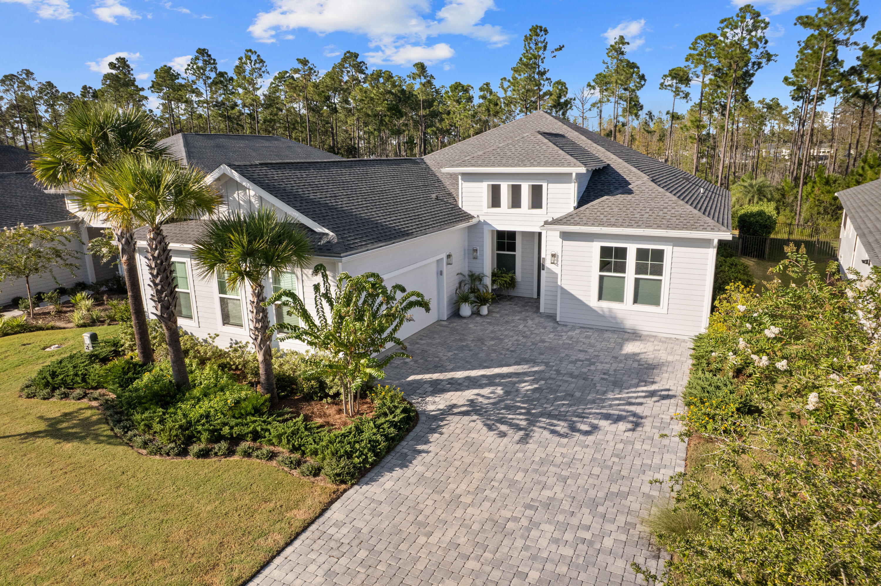 Welcome to Naturewalk at Watersound Origins, a luxury gated community along the 30A corridor offering exclusive resort-style amenities. This stunning 4BR|3.5BA Redington floorplan rests on a premium, ultra-private lot backing to a protected nature preserve delivering serene views & complete tranquility.  Thoughtfully designed for effortless single-level living, the open concept layout seamlessly blends indoor/outdoor spaces.  With over $250k in curated upgrades & offered FULLY FURNISHED, every detail has been selected for elegance and comfort.  

Inside you'll find 10ft ceilings, 8ft doors, custom woodwork, Levolor top-down/bottom-up cellular shades & designer lighting which create a warm refined atmosphere.  Living Rm features beautiful wood beamed ceiling, built-in cabinetry, 5-panel folding glass doors that open to the Lanai complete with motorized, retractable screens-creating seamless indoor-outdoor living year round! You will fall in love with this dream Kitchen fully equipped with stacked cabinetry that stretch to the ceiling and custom layout upgraded with deep pot drawers, stainless steel appliance package with GE Café 5 burner gas cooktop & wine fridge, premium quartz island with waterfall edge wrapped in shiplap, under cabinet lighting & water filtration system. 

Primary Suite is a true sanctuary tucked away at the rear of the home flooded with natural light & offering direct lanai access.  Spa-inspired bath boasts a soaking tub, walk-in shower, dual vanity & a showstopping custom closet designed with organization and style in mind!  Guest suites are equally refined, each with en-suite baths enhanced with wainscoting & elegant finishes.  Additional highlights include a spacious laundry room with tons of cabinetry, sink & custom coat closet - W/D stay, 2 car garage with EV charger outlet & additional refrigerator along with garage ceiling storage racks.
Step outside to experience the crown jewel of this home - a backyard oasis featuring a 14 x 26ft saltwater pool w/an 8 x 8ft tanning ledge, sheer descent waterfall, glass bead gunite finish and lush professional landscaping & lighting along w/sprinkler system - overlooking the nature preserve.  Whether hosting summer barbecues or enjoying quiet evenings under the stars, this outdoor retreat is the ultimate extension of your living space.

As part of Naturewalk at Watersound Origins, residents enjoy access to all Origins premier amenities including resort-style pools, hot tub, firepit, fitness centers, pickleball & tennis courts, walking trails, unlimited golf, playgrounds, access to Lake Powell w/complimentary kayaks for residents-all within this non-short-term rental community.  Additionally, at the neighborhood entrance, Watersound Town Center is growing and includes Publix, multiple restaurants, coffee shops and much more.  30Avenue, Rosemary and Alys Beach are just a short bike ride away!  Enjoy everything the sugar white sands of the Emerald Coast has to offer!