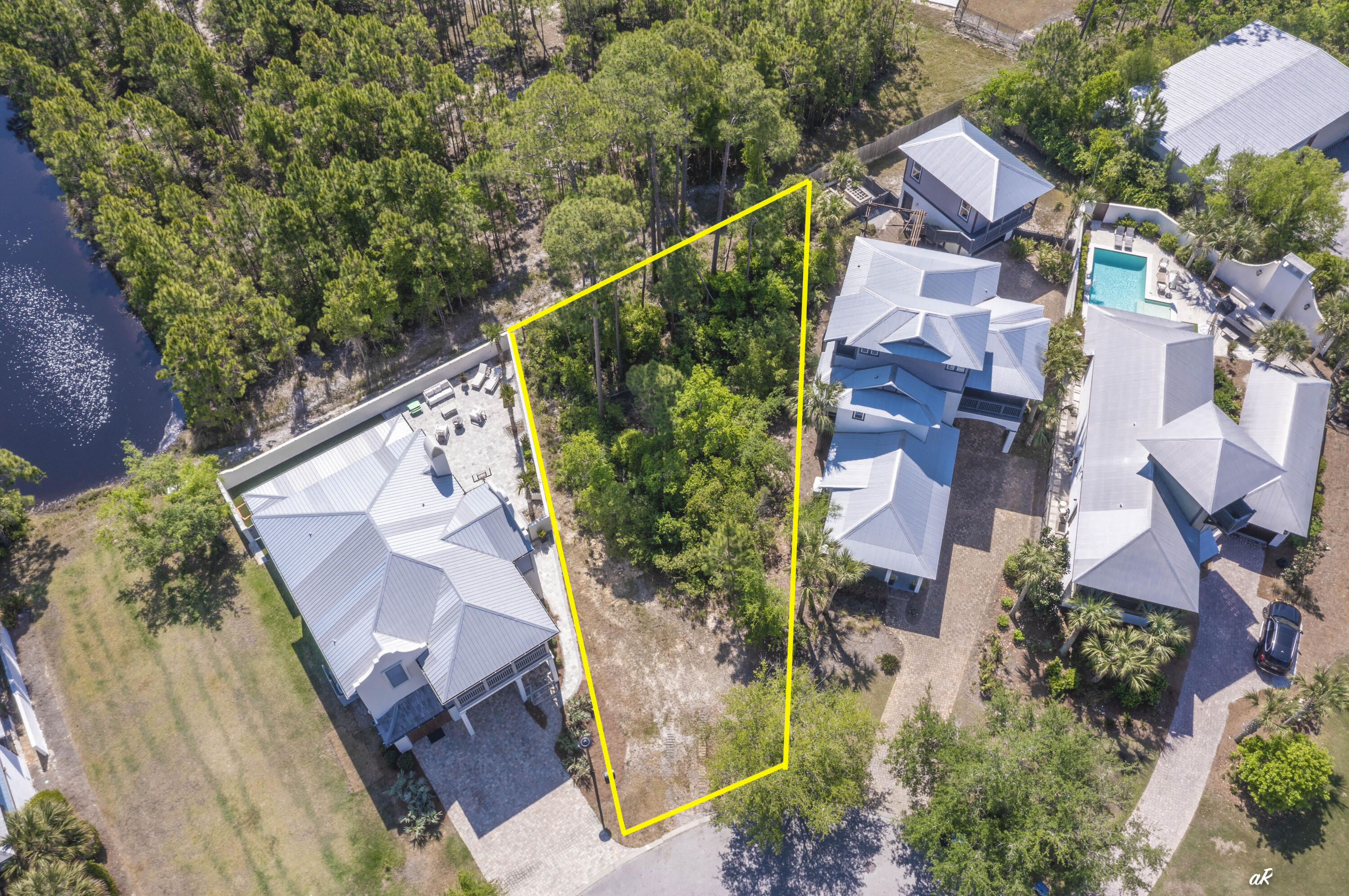 Build your dream home at 5309 Hometown Lane in the exclusive, gated community of Martinique! Located on the quiet East End of Panama City Beach, Martinique is highly sought after for its classic ''Old Florida'' charm, peaceful nature trails, and freshwater lakes. It's a very golf-cart-friendly neighborhood packed with great amenities, including an island-style community pool, a pavilion, a playground, and a basketball court. The location is unbeatable. You're just a short ride away from the white-sand beaches of St. Andrews State Park, the Grand Lagoon, Lighthouse Marina, and local waterfront staples like Captain Anderson's and The Grand Marlin. This is a great opportunity to secure a prime, buildable lot in one of PCB's best neighborhoods.