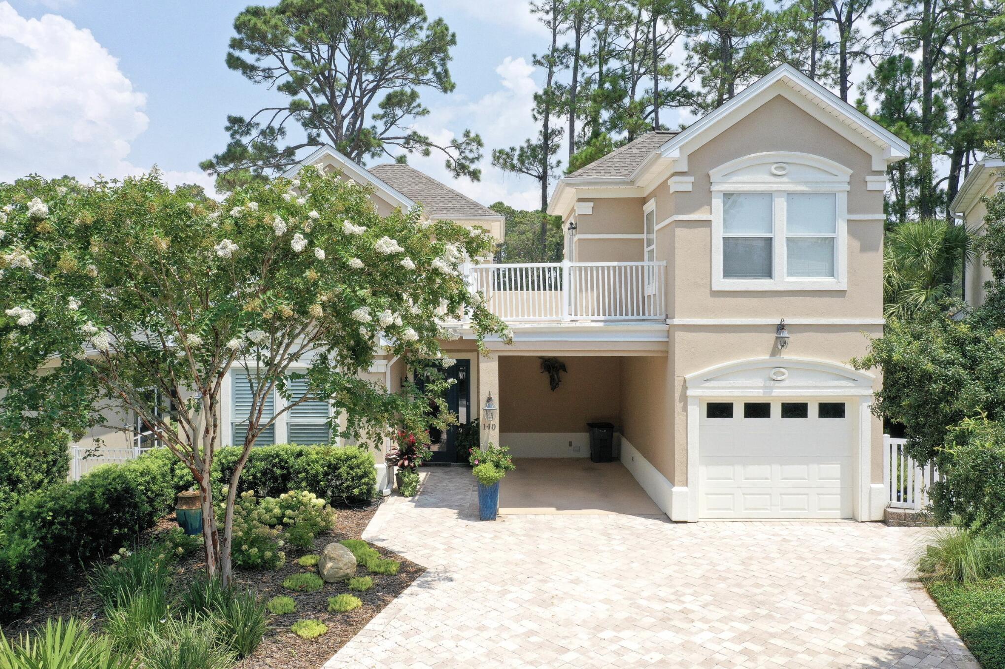 Located in one of the most desirable golf course communities along Scenic Highway 30A, this beautifully updated home at 140 Masters Court offers golf course views, a highly sought-after floor plan, and close proximity to the Gulf. The home sits just minutes from the beach with convenient access via Martha's Lane or the Lake Causeway.

The property enjoys beautiful views of the Santa Rosa Golf & Beach Club's 18-hole, par-72 championship course, with the home positioned along the third tee. Expansive windows and abundant natural light bring the outdoors in, creating a bright and welcoming atmosphere throughout the home.

The location and floor plan within the neighborhood is one of the most desirable, situated on a quiet cul-de-sac with golf course views and the community pool conveniently located right across the street. The heated and chilled community pool allows for year-round enjoyment, and the HOA provides front-yard maintenance, helping to simplify ownership. The neighborhood is also rental-restricted, creating a more private and residential environment.

Designed with comfort and flexibility in mind, the 4-bedroom, 4-bathroom floor plan features a primary suite on the first floor along with an additional first-floor bedroom. Upstairs, you will find another bedroom with its own ensuite bathroom, while a separate detached guest suite provides a private retreat ideal for visiting guests, a home office, or multi-generational living. The home also offers ample storage throughout, including multiple storage closets and linen closets for added convenience.

The kitchen is both stylish and functional, showcasing quartz countertops, custom cabinetry, stainless steel appliances, a porcelain sink, tile backsplash, and under-cabinet lighting. Throughout the home, shiplap accent walls and plantation shutter window treatments add coastal character and timeless appeal.

Outdoor living is a highlight of the property with multiple outdoor spaces, including a screened-in lanai, creating an inviting setting for relaxing or entertaining.

Additional practical features include parking for four vehicles, with two driveway spaces, a covered carport, and a one-car garage, offering both convenience and flexibility for owners and guests.

The current owners have made numerous improvements to enhance both comfort and peace of mind, including the addition of a whole-house generator, updated roof sundeck, dedicated HVAC for the upstairs guest suite, a newly fenced backyard, extensive landscaping, shutters on the upstairs guest suite and carriage house, new exterior light fixtures, upgraded low-voltage landscape lighting and irrigation systems, a renovated carriage house bathroom, and a new kitchen refrigerator.

With golf course and pool views, thoughtful upgrades, and close proximity to the Gulf, 140 Masters Court offers the opportunity to enjoy the relaxed coastal lifestyle that makes the 30A area so special.