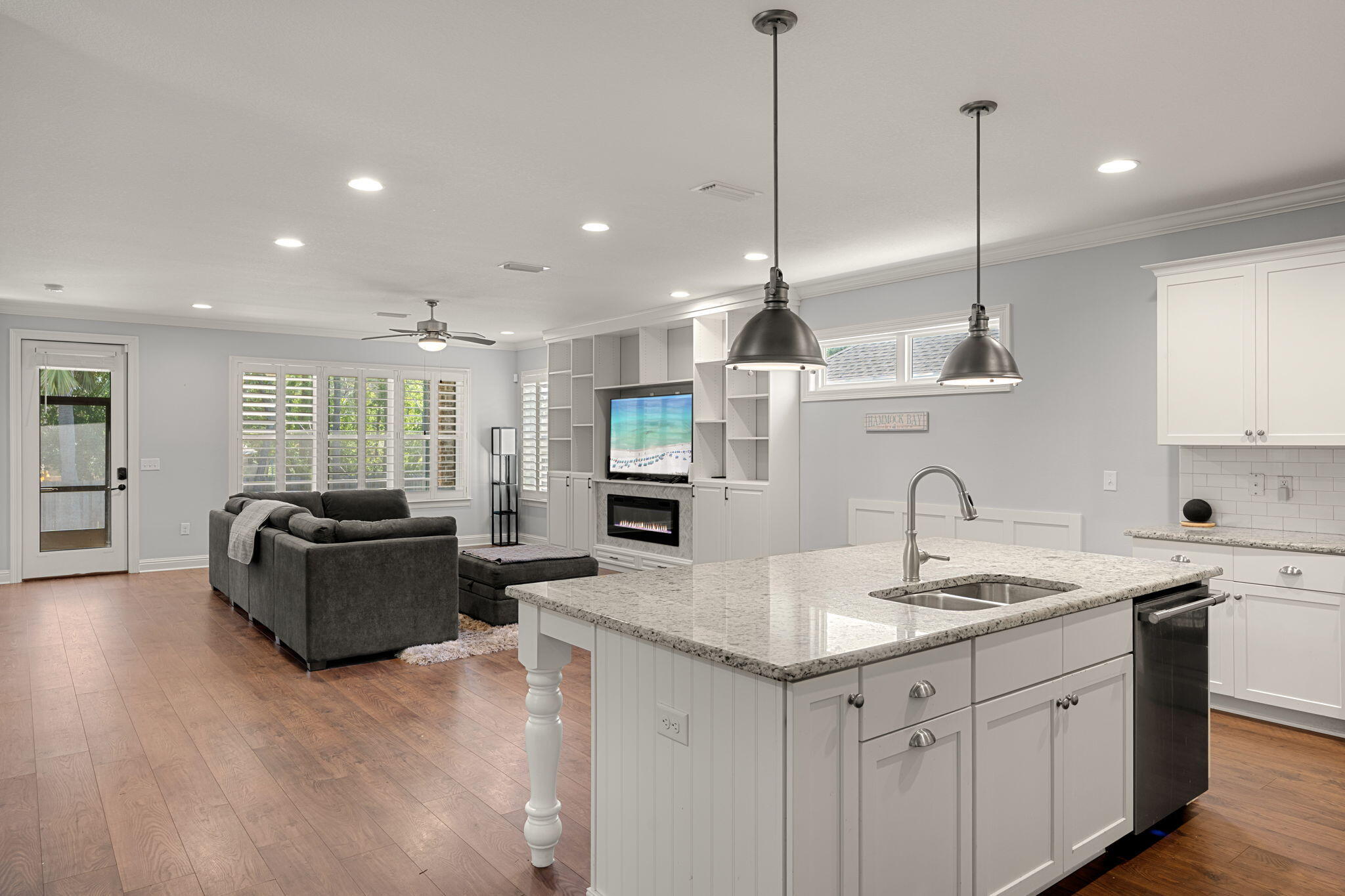 Come check out this custom-built Randy Wise home featuring a home warranty,  open floorplan that is great for family gatherings and entertaining. The Kitchen has stainless steel appliances including a gas stove/oven, 42'' cabinets, granite counter tops with a butler's pantry. A large kitchen island and built-in dining room bench with storage. 

Both the family room and primary bedroom feature custom cabinetry with shelving and fireplaces. The primary bedroom has a beautiful en-suite bathroom with a soaker tub, walk-in shower, double vanity and two walk-in closets. There are two additional bedrooms with connecting bath and a flex/office room that also features custom bookcase with shelving and credenza. Plantations shutters throughout, 9-foot ceilings with 8' doors, custom built-ins ... a Rinnai tankless water heater, crown molding, encased windows and doors, high-end porcelain tile in wet areas, and an upgraded HVAC system with an infrared and mold-killing system. An oversized 2 car garage with new garage door opener and a pull-down attic for storage. Outside you'll find a large, fenced, in yard with a programmable irrigation system and new irrigation pump.

Hammock Bay is only 19 miles to the world famous 30A beaches with dining and a thriving music scene. Hammock Bay has three clubhouses, multiple pools which includes a lap pool for active swimmers, Windmills Town Center with a grocery store, Props Brewery and food truck court, two 24/7 fitness centers, pickle ball courts, miles of walking and bike trails, Canine Commons, Playgrounds, Sports Complex. The bayfront clubhouse and dock provide direct access to Choctawhatchee Bay, perfect for enjoying sunsets, kayaking, fishing, or simply taking in the waterfront views. If you have not been to Hammock Bay you have to come take a tour of this amazing planned community! Buyer to verify square footage, lot dimensions and all information deemed important to them.
