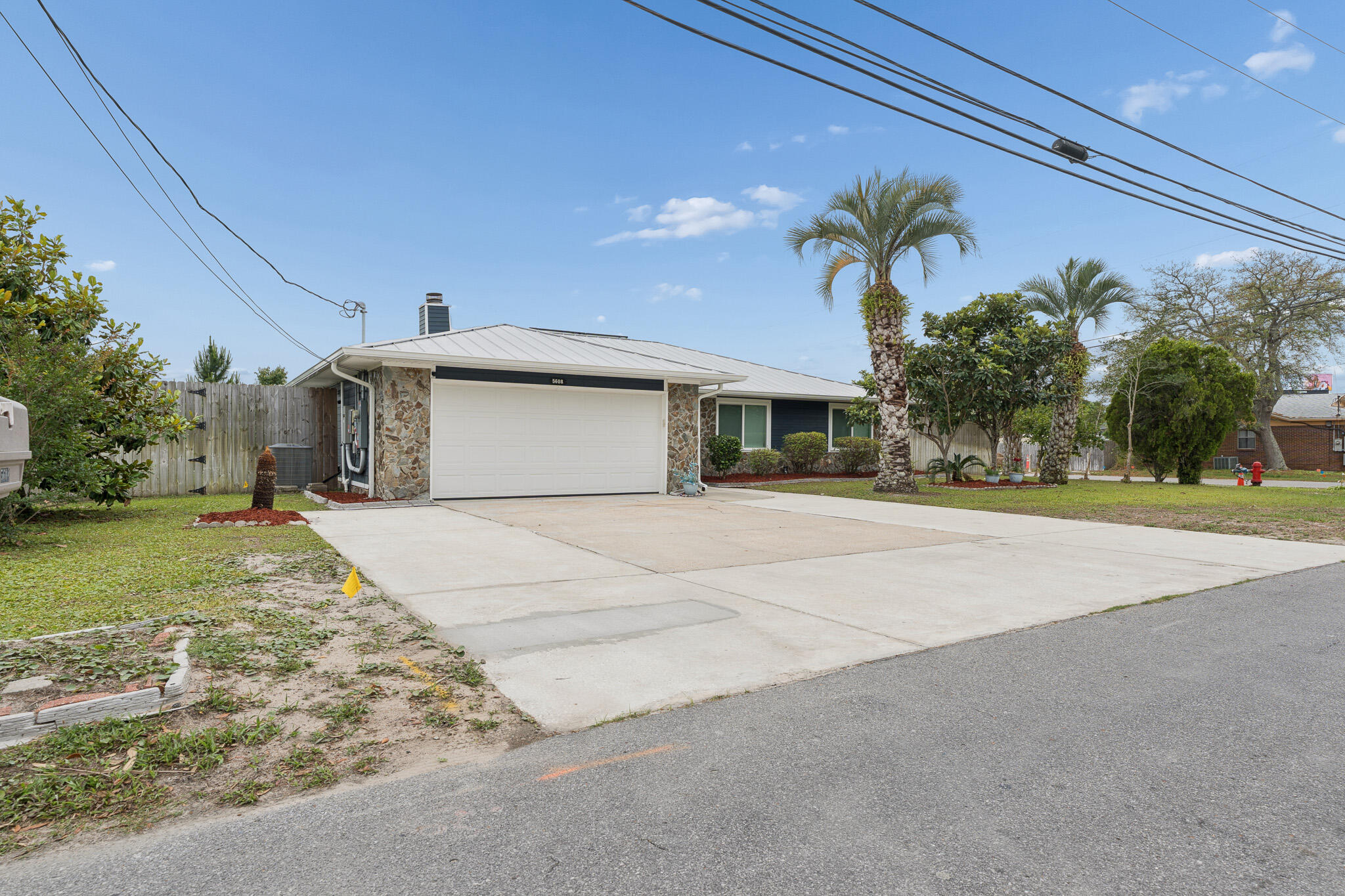 $5K toward Buyers closing costs!  This beautifully updated like-new home in Callaway offers modern comfort, thoughtful upgrades, and convenient access to everything the area has to offer. Located just minutes from shopping, restaurants, and waterfront recreation, enjoy being approximately 0.4 miles from fishing charters at Pier 98, 1.4 miles to a public boat ramp, 4 miles to Tyndall Air Force Base, and about 33 miles to St. Andrews State Park. Extensively remodeled following the hurricane, this home features updated electrical, plumbing, and gas lines for added peace of mind. Designed with efficiency and comfort in mind, upgrades include a tankless gas water heater, whole-house generator, solar panels that will be paid off at closing, impact-resistant windows, and automatic shades. The kitchen is a standout with stainless steel appliances, gas range, quartz countertops, decorative glass backsplash, and an oversized island with ample space for entertaining, gathering, or game nights. Interior finishes include recessed lighting, updated fixtures, and luxury vinyl plank flooring throughout. The spacious primary suite features dual closets and a spa-inspired bath complete with an open walk-in shower, jetted soaking tub, Bluetooth speaker, and smart lighting features. The guest bath has also been tastefully updated with a glass tub enclosure, quartz countertop, and decorative sink. Exterior improvements include durable Hardie board siding and a standing seam metal roof with  all roof boots resealed in 2025.  Step outside to enjoy the covered patio and fully privacy-fenced backyard. A 12x20 site-built shed with insulation, electricity, and its own covered patio provides excellent flexibility for hobbies, storage, or workspace. The backyard is enhanced with fruit trees, a fire pit area, and an additional exterior outlet ready for future outdoor additions such as a hot tub. Don't miss your opportunity to own this extensively upgraded home with modern conveniences and room to enjoy both indoors and out. Buyer to independently verify all information, measurements, dimensions, restrictions, and any matters deemed important.