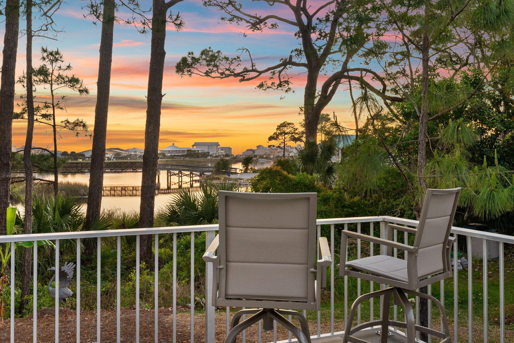 Featuring the largest single-family homesite on Oyster Lake, one of South Walton's rare coastal dune lakes, this 1.56-acre property offers a level of privacy and space unrivaled on the lake. With water views, sunset-facing exposure, and exceptional parking capacity, this is a 30A opportunity unlikely to be replicated.
Originally built in 1994 and updated over time, the residence offers over 3,000 square feet with 5 bedrooms and 4 full bathrooms, along with a versatile bonus room ideal for a game room, media space or additional living area.  The layout is both comfortable and functional, ready to enjoy as-is or tailor to your vision.
Perfectly positioned to embrace its surroundings, the home captures expansive views across Oyster Lake with the Gulf shimmering beyond, setting the stage for  stunning sunsets each evening. Whether relaxing on the deck or in the heated, saltwater pool overlooking the lake, the setting feels immersive and serene. Inside, the primary suite, kitchen, living, and dining areas are all thoughtfully oriented to the water, creating a seamless connection between indoor and outdoor living.
What further distinguishes this property is how effortlessly it blends lifestyle and functionality.  A private dock on Oyster Lake invites easy days on the water, from paddleboarding at sunrise to kayaking at sunset.  The residence itself sits high and dry in Flood Zone X, while the 1.56-acre homesite provides a level of privacy rarely found along 30A. A 3-car garage, parking for 11+ additional vehicles, and an RV pad with electric, water, and sewer hookups offer exceptional flexibility.
Just a 6-minute walk to the beach, this home allows you to enjoy the 30A lifestyle without the hassle of public parking.  Spend the morning on the sand, return home for lunch, and head back with ease. With three convenient access points to Highway 98, you'll also benefit from smooth connectivity without the typical traffic challenges.
The views are protected, the setting is peaceful, and the combination of acreage, waterfront, and proximity to the Gulf is truly exceptional.