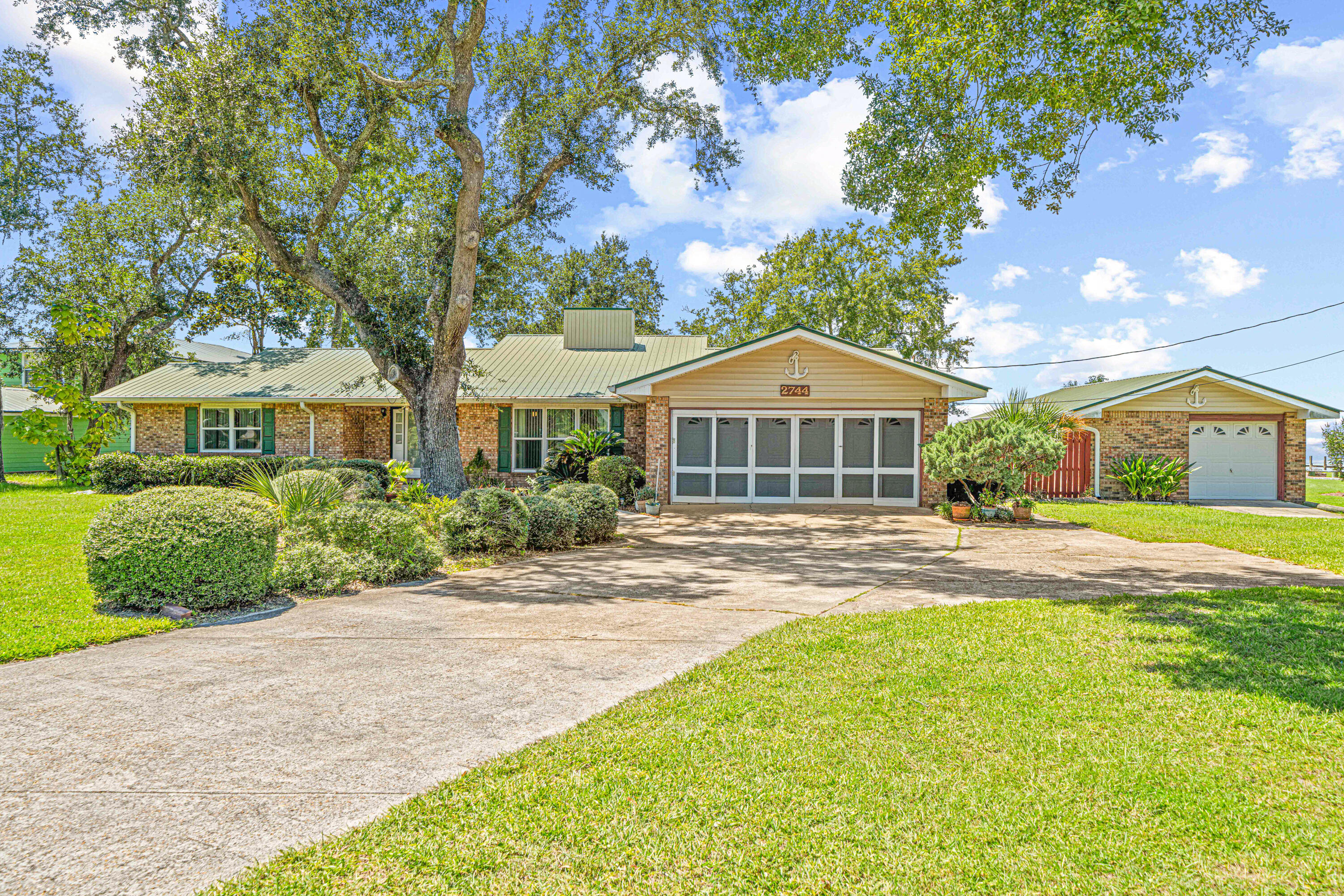 Experience true waterfront living in this charming 3-bedroom, 3-bath Florida cottage offering 1,835 sq. ft. of well-designed space. Built in 1980, this solid brick home sits on TWO expansive waterfront lots overlooking the stunning Choctawhatchee Bay. This home features spacious living areas with timeless character, split-floor plan with a large Florida room and water views from every bedroom! Detached carport & outdoor storage shed - Large yard with direct bay
frontage - Spectacular sunsets across Choctawhatchee Bay - NO HOA! 
This property is a haven for water enthusiasts. With direct access to
boating, fishing, and swimming, you'll enjoy endless days on the bay.Just down the street, Grady Brown Park offers boat launches,playgrounds, and splash pads for family fun. Located only 10 minutes from the world-class beaches of South Walton and close to shopping, dining, and entertainment, this home perfectly balances relaxation and convenience.Schedule your private showing today and discover waterfront living at
it's finest!
