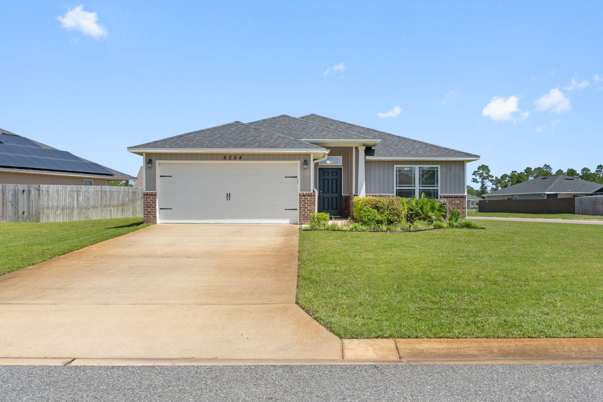 Beautiful nearly new home located in a family-friendly neighborhood, offering the perfect combination of comfort, convenience, and modern finishes. Ideally situated just 18 miles from Hurlburt Field and only 8.5 miles from the white sandy beaches of Navarre, this home provides easy access to shopping, dining, schools, and recreation. Inside, you'll find an open and inviting floor plan featuring luxury vinyl plank flooring throughout the main living areas and comfortable carpeting in the bedrooms. The kitchen is equipped with granite countertops, undermount sinks, stainless steel appliances, and ample cabinet and counter space, making it ideal for everyday living and entertaining. Granite countertops continue throughout the bathrooms, creating a cohesive and upscale feel. The spacious primary suite offers a private retreat with an ensuite bath featuring a large soaking tub, separate tiled shower, and plenty of room to relax and unwind. Whether you're looking for your first home, a place to accommodate a military relocation, or simply a move-in-ready property near the beach, this home checks all the boxes. Schedule your showing today and discover all that this beautiful property has to offer! 🏡🌴