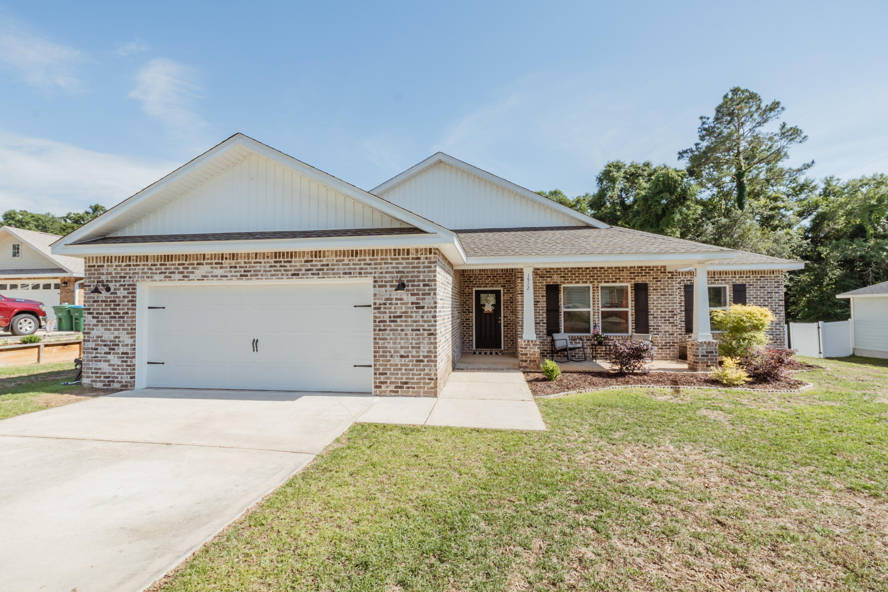 Available 06/15/2026....country home located in Baker.  1 block from Baker School (K-12).  4/2 floor plan boasts open concept living with 1789 sqft.  Easy commute to bases, beaches, and shopping with the privacy of a small community.  Craftsman style home features a large covered front porch, 2 car garage and great curb appeal.  Entry way is spacious for a hall tree or foyer table.  The living room can accommodate large furniture and is open to the kitchen and dining area.  Stainless appliance package, granite, and beautiful cabinetry is found in this home.  Spacious bedrooms and bathrooms.  LVP is in the main living areas with carpet featured in the bedrooms.  Covered back patio for outdoor entertaining.  Privacy fenced HUGE back yard is perfect for family fun and is pet friendly with owner approval.  Home is located on a cul de sac for minimal road traffic.  No inside smoking or vaping in the home or garage.  Pet rent is applicable for approved pets.
