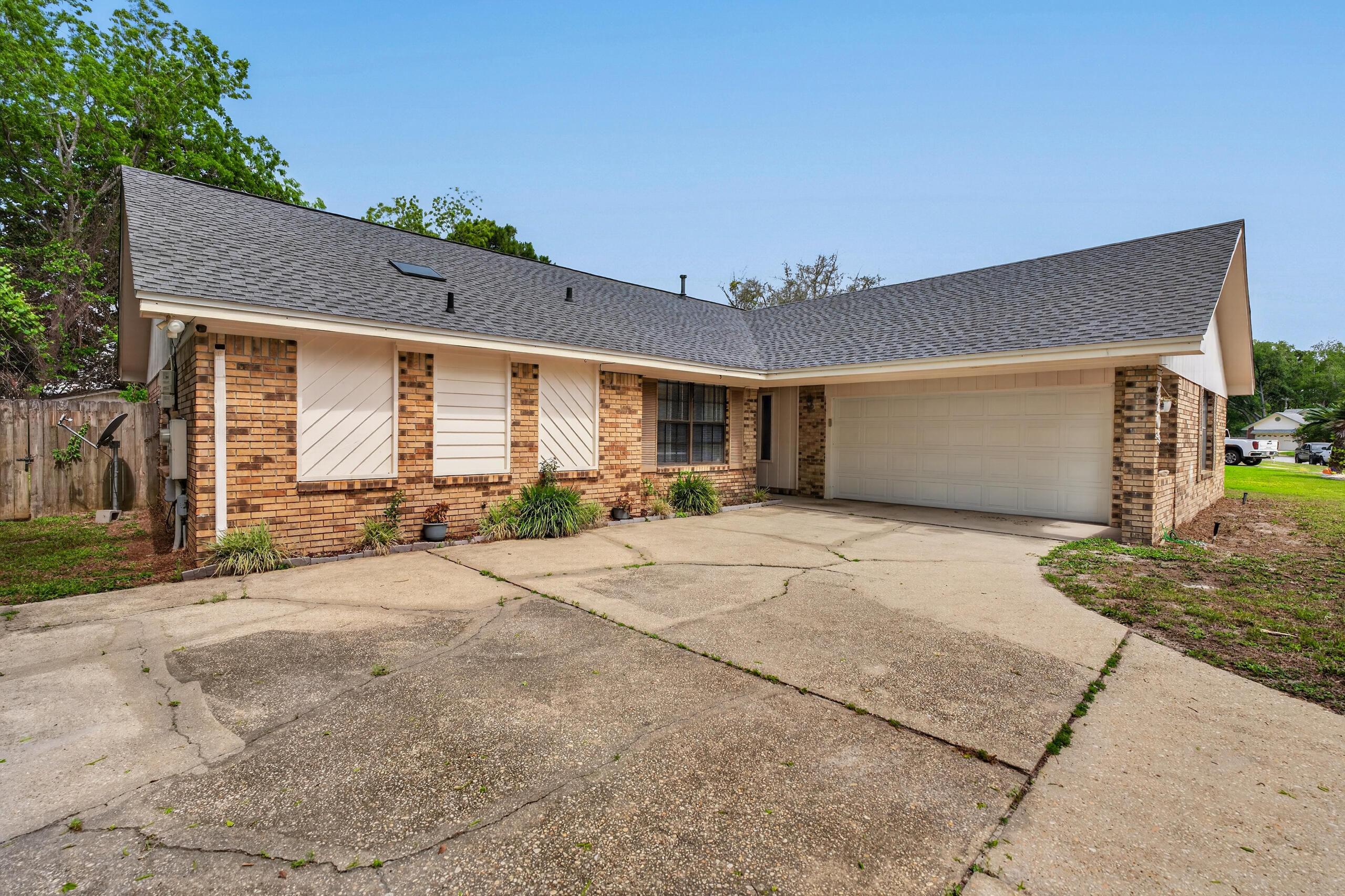 Spacious 3-bedroom, 2-bath home with over 2,000 sq ft in a highly sought Navarre neighborhood just minutes from the beach and Eglin AFB. Conveniently located within walking distance to newer Publix Plaza. Inside, you'll find vaulted ceilings, updated LVP flooring in the bedrooms, and a functional, light-filled layout. The sunroom offers versatile additional living space ideal for relaxing or entertaining. Situated on an oversized lot with plenty of room to enjoy outdoor living. Move-in ready with potential to customize and add value. A HUGE WIN! Did I mention paid off solar panels on a 2022 installed roof, newer hvac & water heater.. keeping insurance & utilites low. Come make this house YOUR home!