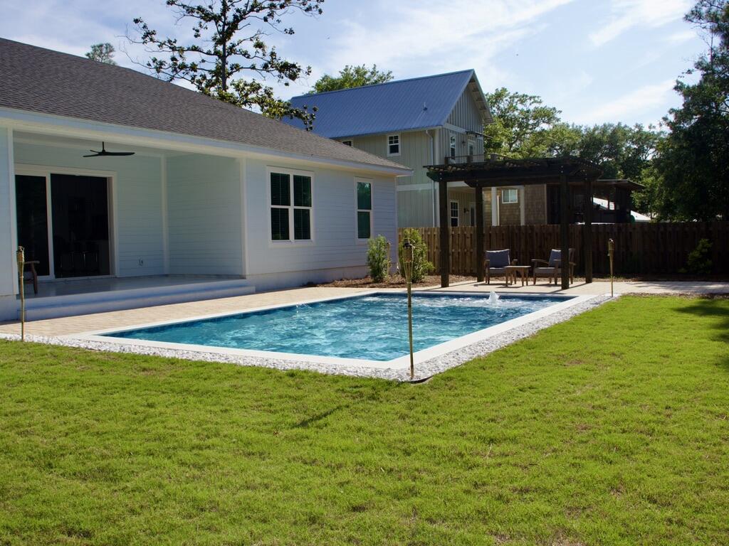 Completed in 2024 and ideally located just north of Hwy 98 with easy access to 30A West, this 4BR/2BA home sits on a spacious ~0.31-acre lot with no rental restrictions. The newly finished backyard offers a private retreat with a pool, paver deck, pergola, and thoughtful landscaping. Inside, the home features 10-foot ceilings, tile flooring, crown molding, and custom trim throughout. A wide three-panel sliding door fills the living area with natural light and opens to the backyard. The primary suite includes a soaking tub, a walk-in shower with a rain head, and a custom closet. Fully fenced with irrigation and a paver driveway. Located ~1.2 miles to Bay Circle Boat Ramp and ~3.5 miles to beach access. Sunlight, space, and coastal charm come together in this beautifully built 2024 home just north of Hwy 98, with easy access to 30A West. Set on a generous ~0.31-acre lot, this property offers the rare combination of privacy, flexibility, and room to breathe, all just minutes from the Emerald Coast's beaches, dining, and boating.
The newly completed private pool and outdoor living area create a backyard designed for relaxing afternoons and effortless entertaining. Surrounded by a spacious paver deck and thoughtful landscaping, the outdoor space feels like your own personal retreat. 
Inside, the home feels bright, open, and welcoming. Ten-foot ceilings, elegant trim details, and large impact windows fill the space with natural light while adding a polished coastal feel. The open living area is anchored by a striking tile-wrapped fireplace, creating a warm focal point for gathering with family and friends.
The kitchen is truly the heart of the home, featuring an oversized quartz island perfect for morning coffee, casual meals, or hosting. It flows seamlessly into both a breakfast area and an additional flexible dining space that can easily adapt to your lifestyle -- whether you envision a second lounge, play area, or entertaining space.
A wide three-panel sliding glass door connects the indoors to the backyard, creating that seamless indoor-outdoor living experience that makes coastal homes so special.
The primary suite offers a peaceful retreat, complete with a freestanding soaking tub, spacious walk-in shower with rain head, and a custom walk-in closet. Thoughtful storage and built-in organization throughout the home add convenience without sacrificing style.
The yard is fully fenced and provides both privacy and curb appeal, with decorative fencing in the front and a six-foot privacy fence surrounding the sides and rear.
With no HOA and no rental restrictions, this property offers flexibility whether you're looking for a full-time residence, second home, or investment opportunity. Located in Flood Zone X, it also offers added peace of mind.
Just 1.2 miles from Bay Circle Boat Ramp and minutes to 30A, this home captures the laid-back coastal lifestyle while still feeling tucked away and spacious.
For boating enthusiasts and investors alike, the location is a major advantage. The home is situated approximately 1.2 miles from Bay Circle Boat Ramp, providing convenient water access to Choctawhatchee Bay. The parcel provides ample space to accommodate boat storage on-site.
Beach access is equally convenient, with the nearest public beach access approximately 3.5 miles away, followed by multiple access points along 30A and Scenic Gulf Drive within about 5.5 miles.
Everyday conveniences are just minutes away:
~1.3 miles to Walmart
~2.6 miles to Publix at Grand Boulevard
~5.1 miles to Silver Sands Premium Outlets
With no rental restrictions, this property is ideally suited for short-term vacation rental investment, second home use, or full-time living. The combination of location, construction quality, luxury finishes, and reduced carrying costs (no flood insurance + no HOA) makes this a compelling, income-producing opportunity at the highest level of the market.
