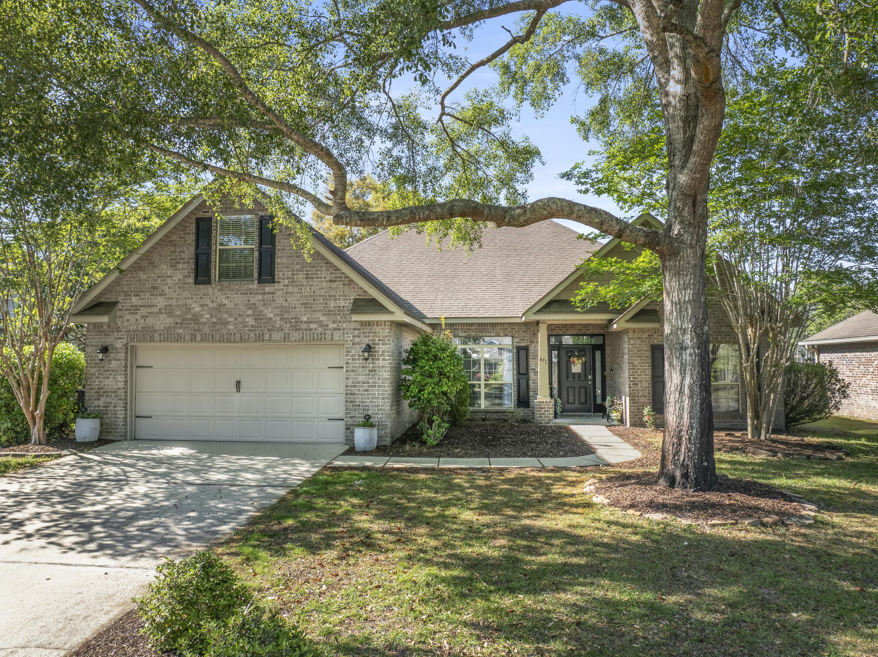 Discover lakeside luxury in this stunning all-brick home in the sought-after Hammock Bay community. Featuring 4 bedrooms plus a versatile bonus room, this property offers serene water views and resort-style amenities.
Enter through the beautiful front door with transom into a bright foyer showcasing new vinyl laminate flooring, 9' ceilings, and elegant crown molding. The spacious great room boasts vaulted ceilings and French doors leading to a covered 12x14 back porch - perfect for enjoying the tranquil lake views.
The gourmet kitchen features tile floors, wood cabinets, stainless steel appliances, and a breakfast bar overlooking the water. The waterfront master suite delights with a
