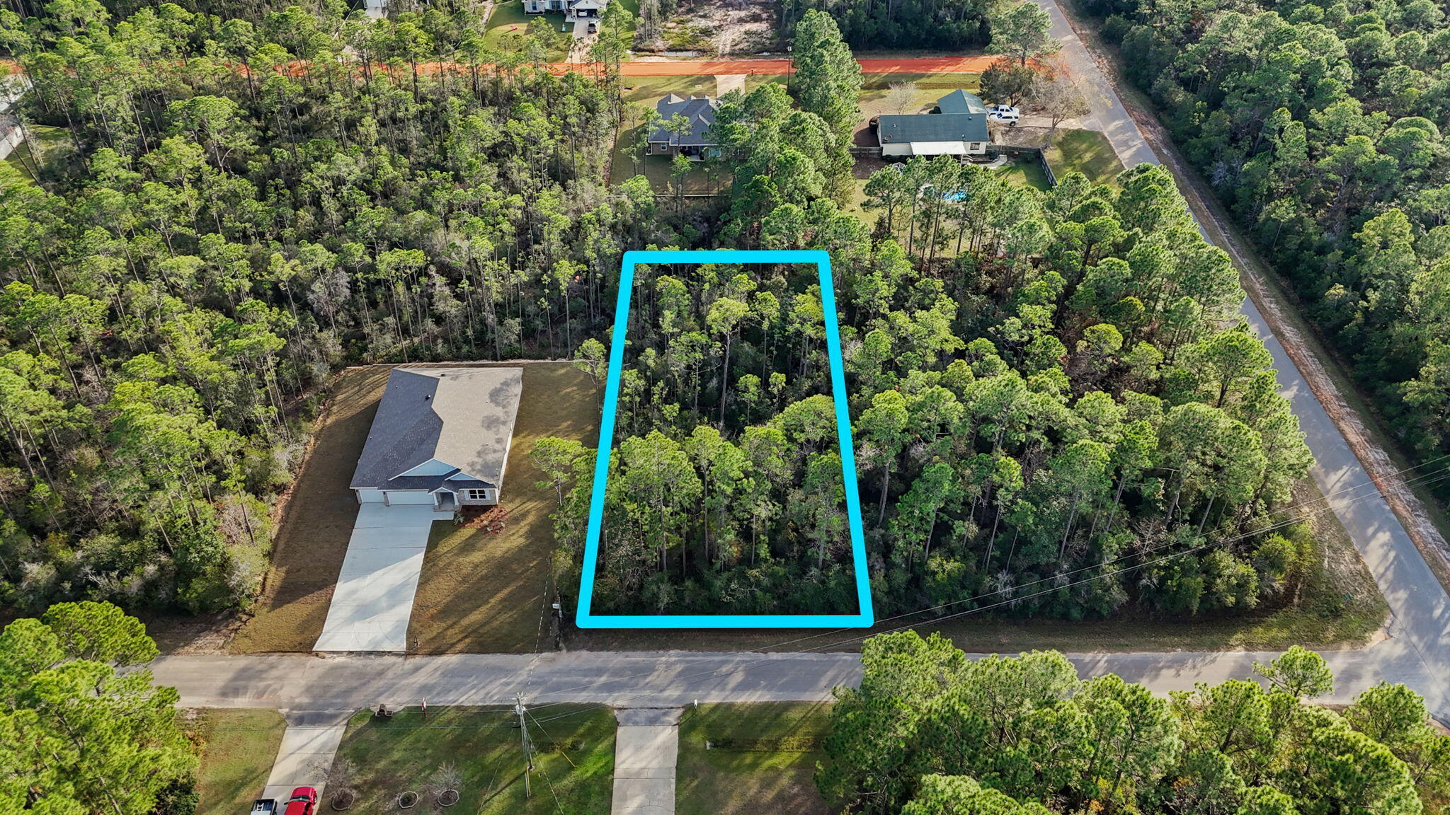 Beautiful lot in Holley by the Sea to build your dream home on! Ownership in Holley by the Sea offers access to their multi-million dollar recreation center with 3 swimming pools, 8 clay tennis courts, a recreation center with a full kitchen that is available to members to rent for parties/events for a nominal fee, fitness center, deeded access to the sound with dock, tennis and pickleball courts, fishing, picnic area, pavilions, RV camp sites and much more. Just minutes to the beaches, dining and shopping. Build your dream home and enjoy the best of Emerald Coast living! Lot is wet but confirmed buildable by a local builder (wetlands study available).