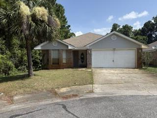 VA REO Property.  Prime location near Hurlburt Field and Navarre's beaches. Positioned at the very end of a cul-de-sac, this all-brick home offers rare privacy with only one adjacent neighbor. The exterior is low-maintenance brick with vinyl soffits; a quick pressure wash will enhance curb appeal instantly. Indoors, fresh paint would elevate the clean, solid interior. The kitchen includes white cabinetry, granite countertops, and stainless steel appliances. Luxury vinyl plank flooring--in good condition except for two small areas in the primary bedroom-  Enjoy a split-bedroom layout, vaulted living room, and dining space just off the kitchen. The primary suite features double vanities, a separate shower and tub, and a large walk-in closet. Move-in ready with simple cosmetic updates to make it feel brand new.