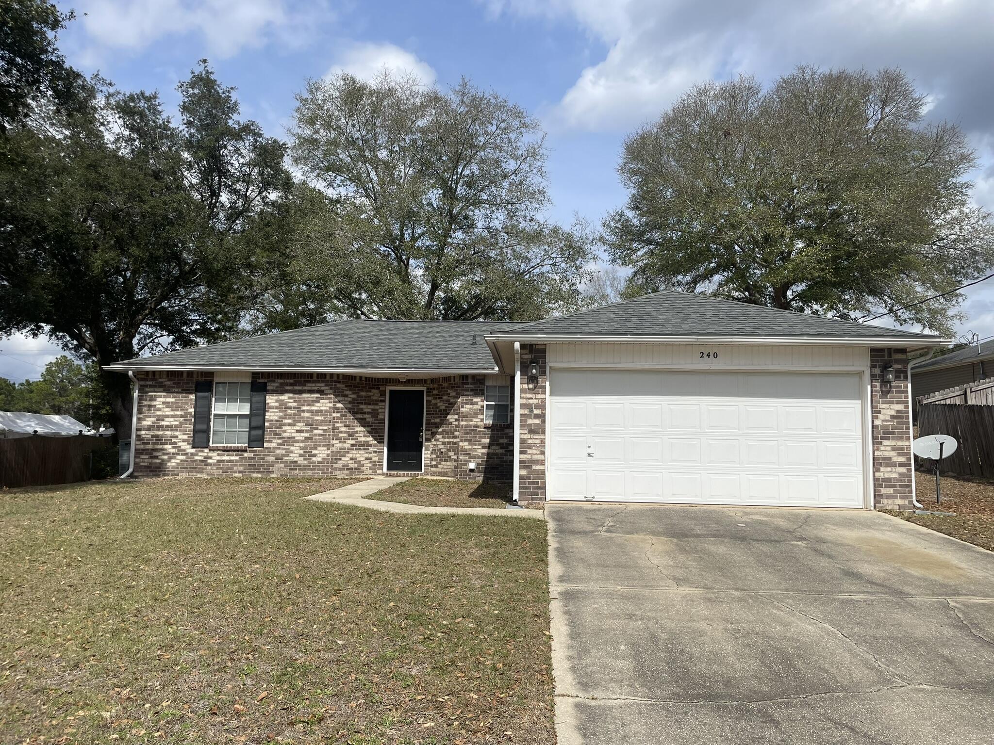 South of I-10 with easy access to Hwy 85 South and the military bases. This 3-bedroom, 2-bath home features a 2-car garage and laminate flooring in the living room, dining area, and kitchen. The kitchen is equipped with a side-by-side refrigerator, stove, and dishwasher. Enjoy the screened back porch overlooking a chain-link fenced backyard. Located on a cul-de-sac with minimal traffic.