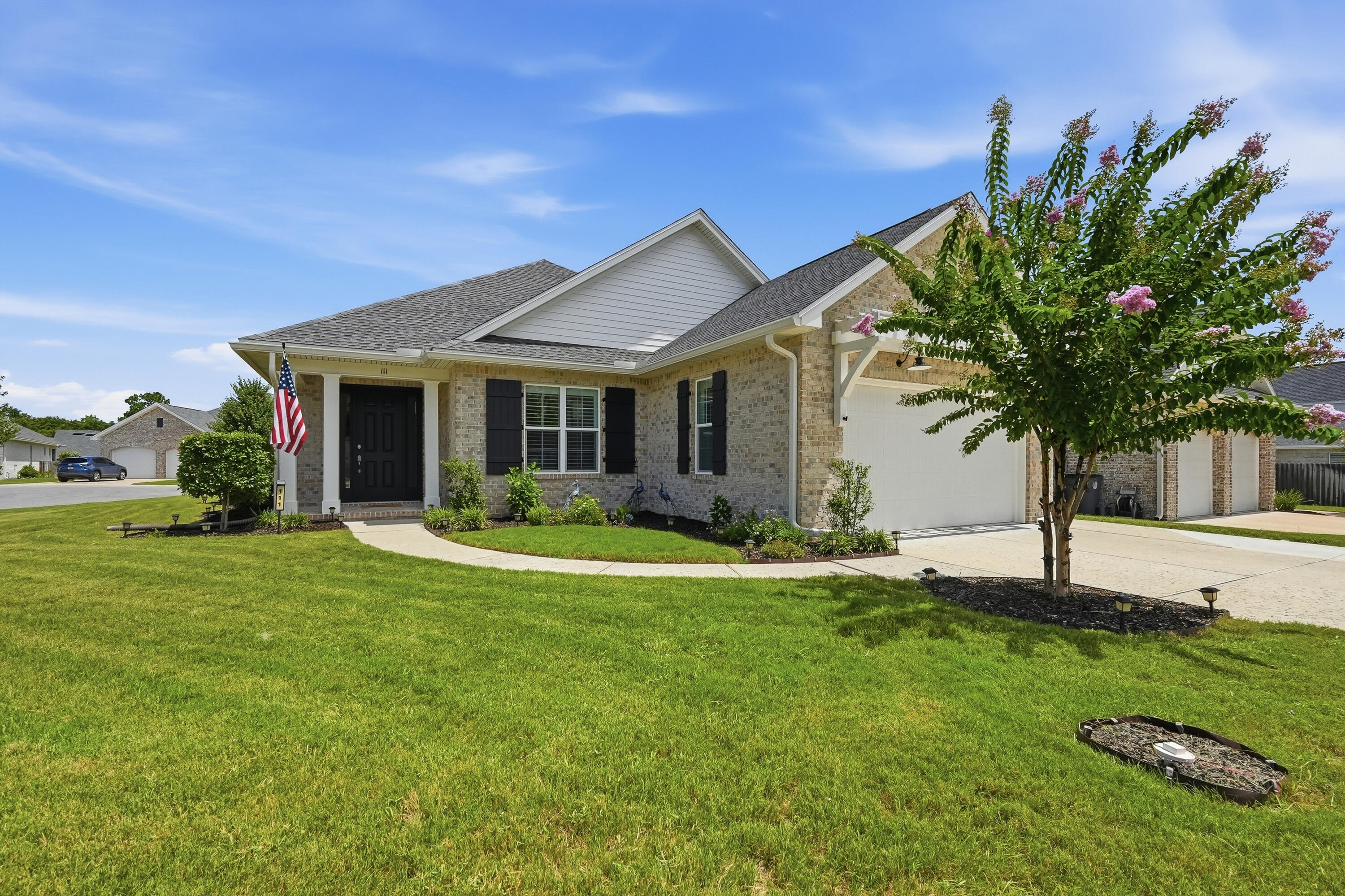 Welcome to this beautiful 4-bedroom, 3-bath home in the heart of Valparaiso, Florida!

Built in 2022, this stunning 2,284-square-foot home offers the perfect blend of modern style, comfort, and convenience. Ideally located just minutes from local military bases, shopping, dining, and the Emerald Coast's breathtaking sugar-white sandy beaches, this exceptional home is also situated within a highly sought-after school district, making it an outstanding choice for families and anyone looking to enjoy all that the area has to offer.

Step inside and discover a thoughtfully designed open-concept floor plan where every room is perfectly positioned for both privacy and everyday functionality. The impressive 8-foot doorways create an airy, spacious feel that makes this home live even larger than its square footage.

At the heart of the home is a beautifully appointed kitchen featuring beautiful countertops, soft-close cabinetry and drawers, a stylish tile backsplash, stainless steel appliances, a gas range, recessed lighting, crown molding, and luxury vinyl plank flooring,  perfectly designed for both everyday living and entertaining.

The owner's suite is a peaceful retreat, complete with a decorative ceiling fan, a bathroom featuring dual vanities, a beautifully tiled walk-in shower with a glass enclosure, and an impressive custom-style walk-in closet with adjustable shelving that offers both beauty and functionality. Guests and family will appreciate the privacy of an additional bedroom with its own ensuite bathroom, making it ideal for visitors, extended family, or multi-generational living.

Step outside to enjoy the enclosed patio featuring a ceiling fan and electrical outlets, creating the perfect space to relax or entertain year-round. The low-maintenance backyard includes a gas hookup, making outdoor grilling and dining effortless. A programmable irrigation system keeps the lawn looking its best, while the spacious garage features a finished floor for a clean, polished appearance.  The home also wired for Ethernet, and features gutters, an exterior space saving tankless water heater for your convenience.  This home has it all.

Perfectly positioned on a desirable corner lot, this home boasts exceptional curb appeal, thoughtful upgrades, and timeless style. Every detail has been carefully considered to create a home that is as functional as it is beautiful.

If you've been searching for a move-in-ready home that combines modern elegance, quality craftsmanship, an unbeatable location, and everyday comfort, your search ends here. This isn't just a house, it's the place you'll be proud to call home.

Buyer(s) is responsible for verifying ALL data and information, including lot size and room measurements, as it is deemed to be reliable but not guaranteed.