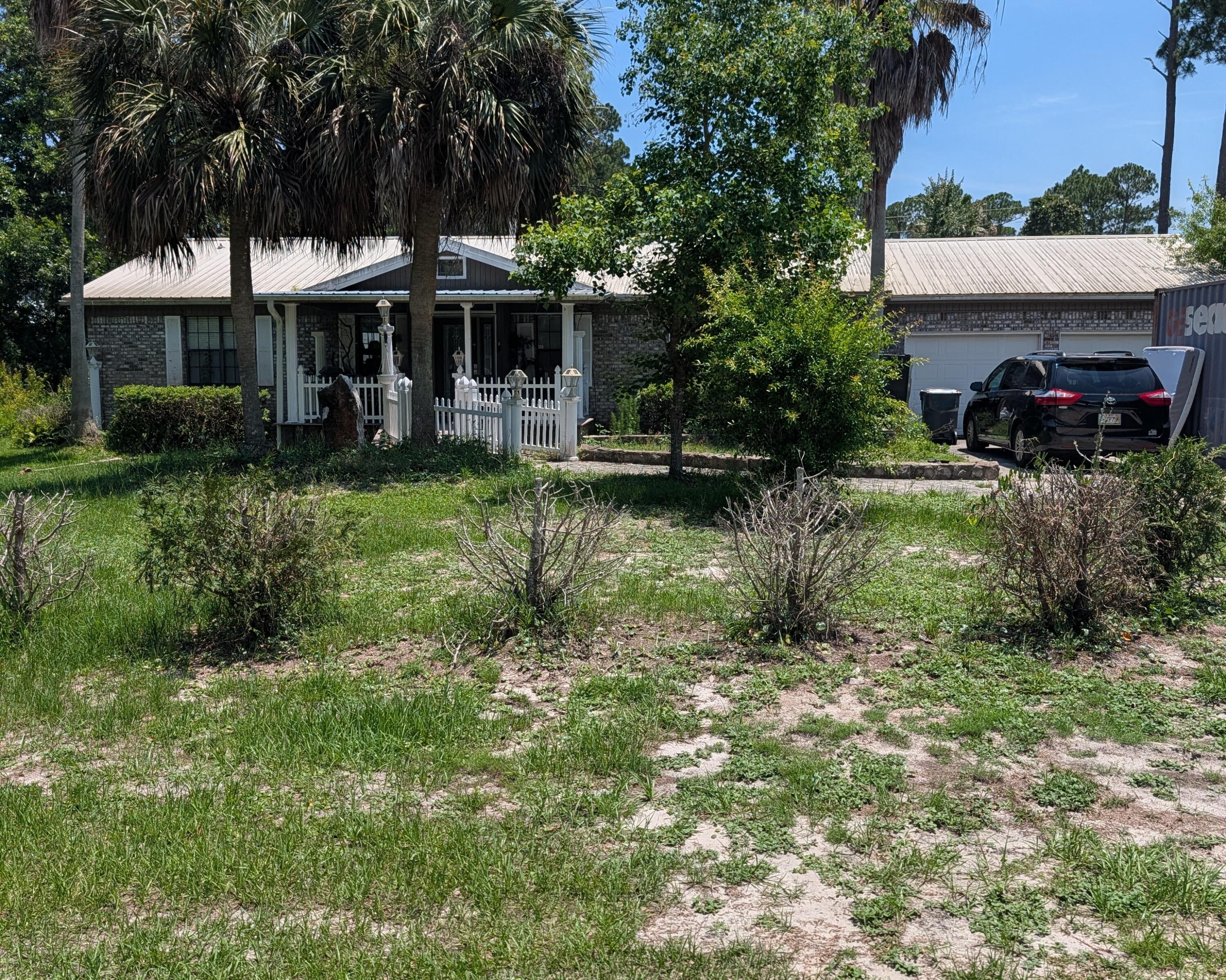 Two private lots with a total of .831 acres. Ranch Style brick home, small pool, attached 2 car garage and close to the beach.  Majority of the lots are Zone x, north right portion is Zone A.