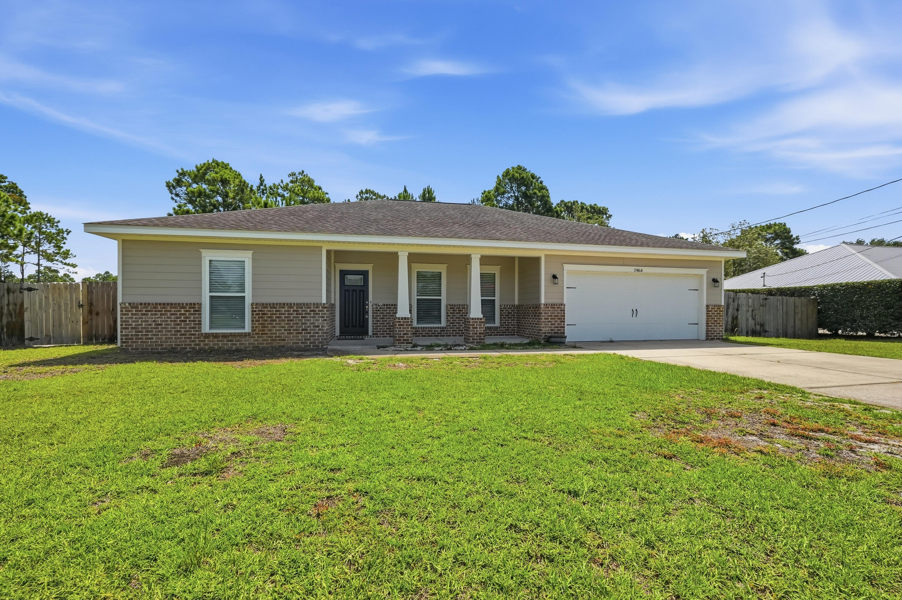 Welcome to this beautifully maintained **4-bedroom, 2-bathroom home** perfectly situated on a desirable corner lot in the sought-after **Holley by the Sea** community in Navarre, Florida. Offering an open, functional floor plan and quality finishes throughout, this home is ready for its next owner. The spacious kitchen features **granite countertops**, **stainless steel appliances**, and **soft-close cabinetry throughout the home**, combining style with everyday convenience. Step outside to enjoy the **nice-sized backyard**, complete with a storage shed, providing plenty of room for outdoor entertaining, gardening, pets, or simply relaxing. The corner lot offers additional privacy and enhances the home's curb appeal. Living in **Holley by the Sea** means enjoying one of Navarre's premier amenities packages, including a recreation center, swimming pools, fitness center, tennis and playgrounds, walking trails, and more. Conveniently located just minutes from Navarre's award-winning white-sand beaches, shopping, restaurants, top-rated schools, Hurlburt Field, and Eglin Air Force Base, this home truly offers the best of coastal living. Whether you're searching for your primary residence, a vacation getaway, or an investment opportunity, this home is one you won't want to miss. Schedule your private showing today!