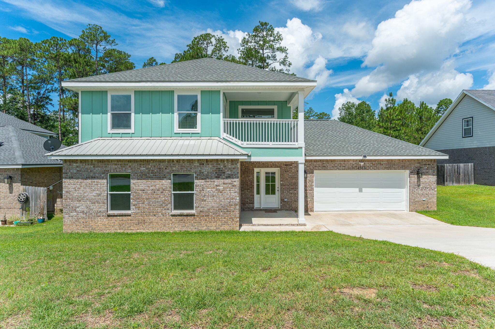 Check out this gorgeous 2024-built, two-story home featuring 4 bedrooms and 3.5 bathrooms, nestled in a desirable South Crestview neighborhood. Thoughtfully constructed with a durable metal roof and premium finishes throughout, this home offers lasting quality along with the added benefits of lower insurance and maintenance costs.

Conveniently located just 10 minutes from Duke Field and 25 minutes from Eglin AFB, this property is perfectly positioned for an easy commute while still offering a peaceful residential setting.

Inside, you'll find an open-concept floor plan designed for both everyday living and entertaining. The culinary-inspired kitchen features granite countertops, stainless steel appliances, and a spacious pantry, while overlooking the living and dining areas to create the perfect gathering space for family and friends. With two primary suites, this home offers exceptional flexibility for multi-generational living, guests, or growing families.

The bathrooms are equally impressive, featuring beautifully tiled baths and showers that add a touch of luxury and durability throughout the home.

Step outside to a beautifully designed outdoor entertaining area, ideal for relaxing or hosting. Upstairs, the luxurious primary suite features a private balcony, providing the perfect retreat to enjoy your morning coffee or unwind at the end of the day.

Don't miss the opportunity to see this home and see the quality of excellent craftsmanship first hand.