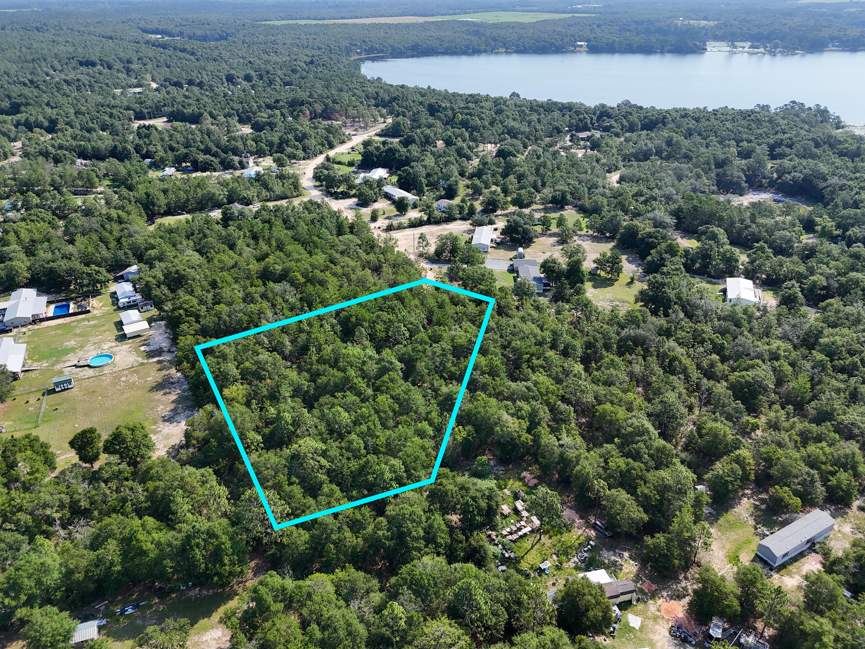 Located North on 331 this wooded lot located at the dead end offers 1.51 acres in the Juniper Lake area. Lot is wooded with mostly all the underbrush gone making the lot easy for you to clear and be able to move your brand-new mobile home to or build a home! Property has water available but will require a septic tank. Power on road for easy access for electricity! This large parcel is just minutes back to town, minutes to public boat launch to Lake Juniper and with being located at the end of the road on a cul de sac you will have privacy you desire! This size parcel is a rare find!