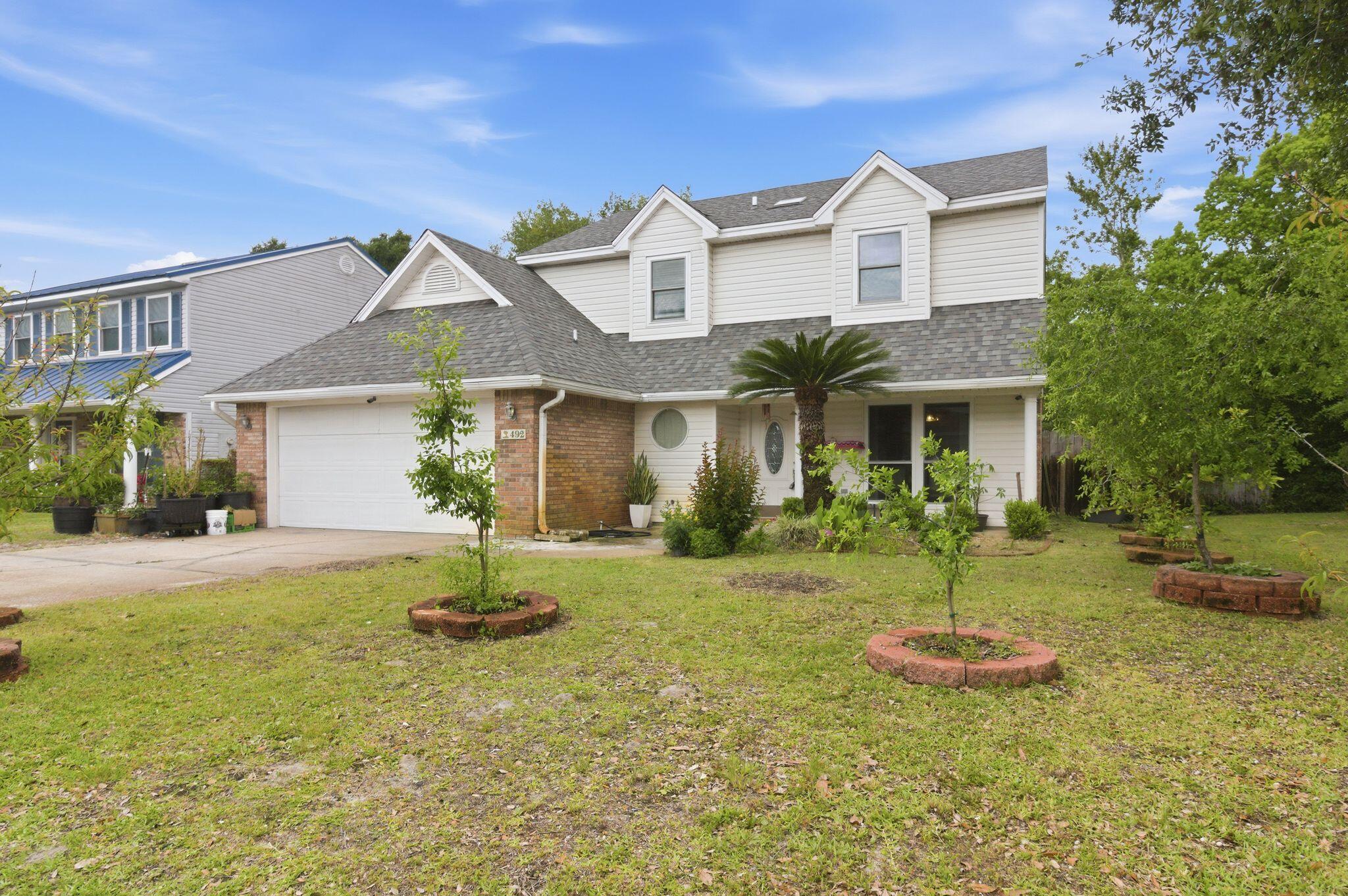 Located in a quiet subdivision, just 2 miles west of Hurlburt Field's front gate, an easy drive to shopping, dining and entertainment in Fort Walton Beach, and to the sugar white sands of Navarre Beach you could find your home sweet home in this Colonial style 2-story, 3 bedroom 2.5 bathroom home.  The first floor is complete with a large living room, separate dining room (or office), and spacious kitchen, and a half bath as well as patio area with access to the back yard. Upstairs you will find an incredible owner's suite, 2 large guest room and the guest bath.  The yard has been lovely cared for and is a gardeners paradise with fruit and flows galore!  Call your favorite Realtor and schedule a showing today!