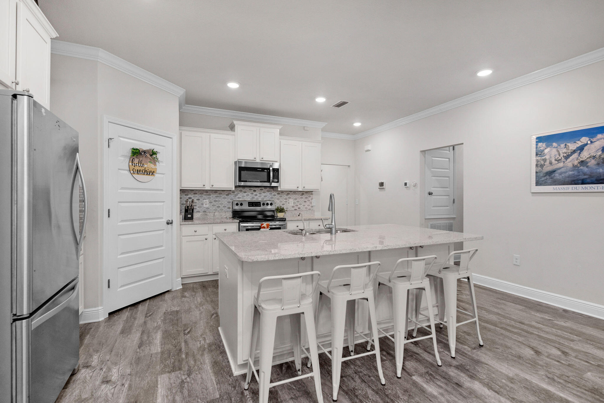 Welcome to this beautiful 3-bedroom, 2-bath home located in the gated Firefly community within the highly sought-after Hammock Bay master-planned development. This well-maintained home features luxury vinyl plank flooring throughout the main living areas and bathrooms, granite countertops, stainless steel appliances, a spacious walk-in pantry, and a large breakfast bar perfect for entertaining.

Step outside to enjoy the screened-in porch and fully fenced backyard, offering both privacy and outdoor living space.

Hammock Bay provides an exceptional lifestyle with resort-style amenities including a fitness center, miles of walking and biking trails, a dog park, general store, restaurant and bar, and year-round community events. Firefly residents also enjoy exclusive access to their own community pool, clubhouse, and pickleball courts.

Don't miss the opportunity to enjoy comfortable living and outstanding amenities in one of Freeport's most desirable communities.