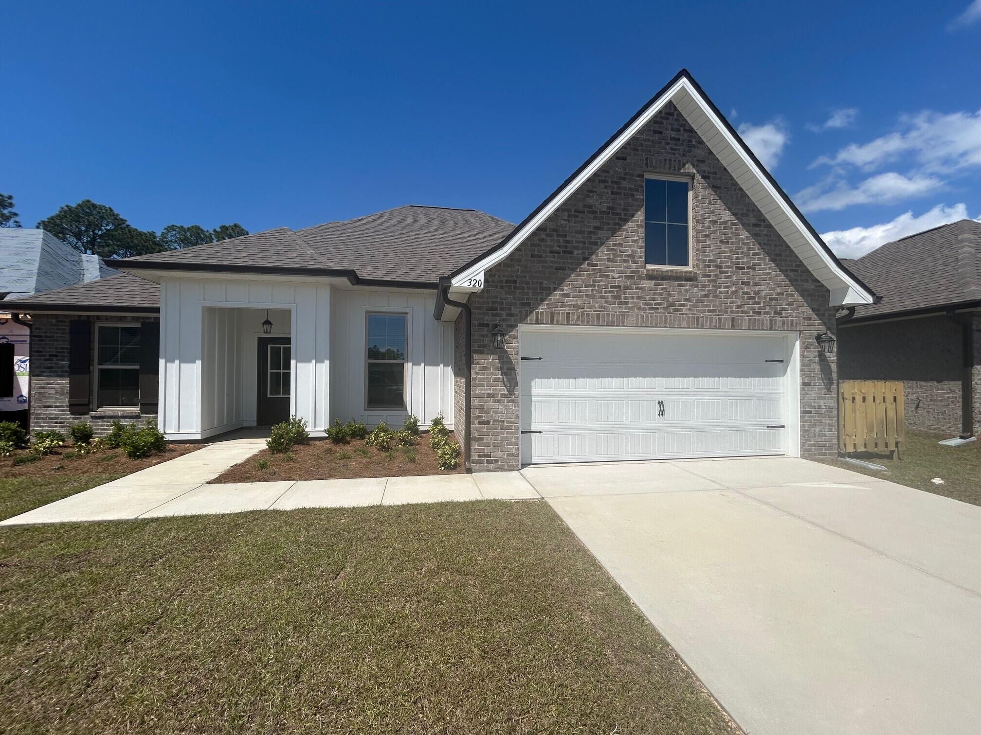 The ROSES V G in Bird Song at Hammock Bay community offers a 3BR/2BA, open and split design with flex space and computer desk/niche. Upgrades added (list attached). Features: double vanity, garden tub, separate custom tiled shower, and 2 walk-in closets in master bath, tray ceiling in master bed, kitchen island, walk-in pantry, covered porches, undermount sinks, crown molding, LED lighting, smart connect WIFI thermostat, framed mirrors in all baths, landscaping package, architectural 30-year shingles, flood lights, and more! Energy Efficient Features: water heater, kitchen appliance package, vinyl low E windows, and more! Energy Star Partner.