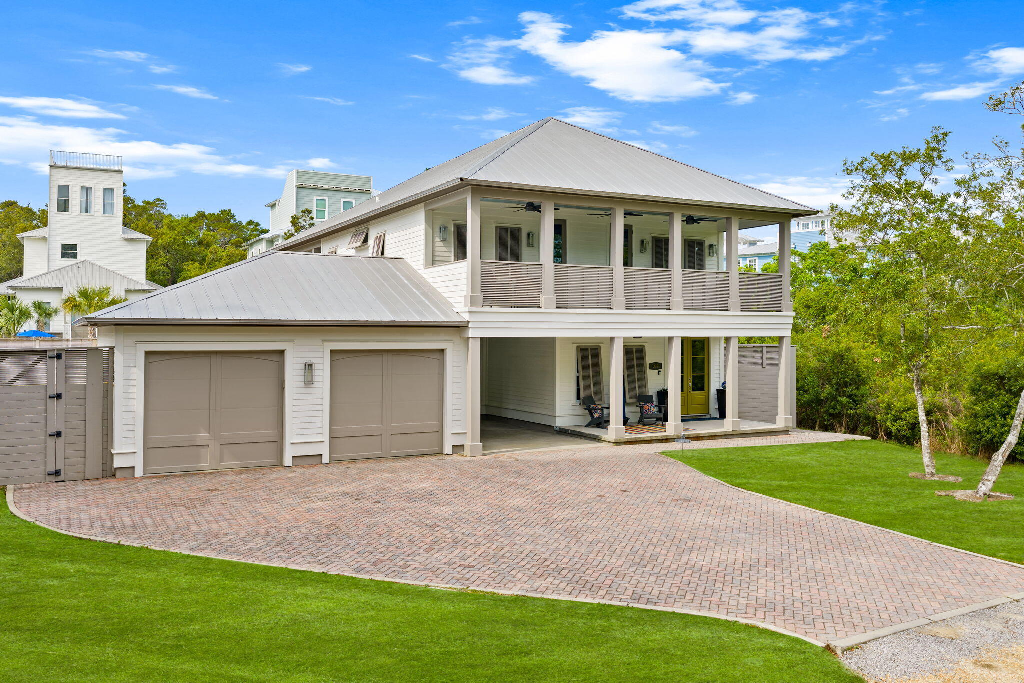 Rare opportunity to own a beautifully updated 5BR/4BA residence in coveted Old Seagrove, bordering Seaside--where irreplaceable location and quality converge. Situated on nearly a quarter-acre, this 2,825 SF home with additional attic expansion potential offers exceptional privacy, scale, and flexibility just moments from the beach. The first level features an open living and dining area filled with natural light from four sets of French doors, complemented by a well-appointed kitchen with KitchenAid appliances, custom cabinetry with Blum drawer systems, and bar seating. A main-level bedroom with ensuite provides flexibility for guests or additional living space. Upstairs, the oversized primary suite offers a sitting area, private balcony, and a spacious bath with dual vanities. Additional bedrooms are thoughtfully arranged with a mix of ensuite and Jack-and-Jill configurations, including a versatile fifth bedroom ideal for a bunk room or media space. Outdoors, the property expands its appeal with an oversized two-car garage with potential carriage house addition and an expansive, fenced yard with ample room for a resort-style pool, putting green, and outdoor entertaining. With no HOA, fewer restrictions, and favorable taxes, the property presents a strong investment profile--projected rental income up to $343K with enhancements of a pool and golf cart--while remaining private enough for a primary or second home. An adjoining quarter-acre lot is also available for purchase, creating a rare opportunity to assemble a near half-acre legacy estate. Positioned along one of 30A's most desirable corridors, owners benefit from walkable access to dining, shopping, and multiple beach access points, combined with the flexibility and long-term upsides that define Old Seagrove.