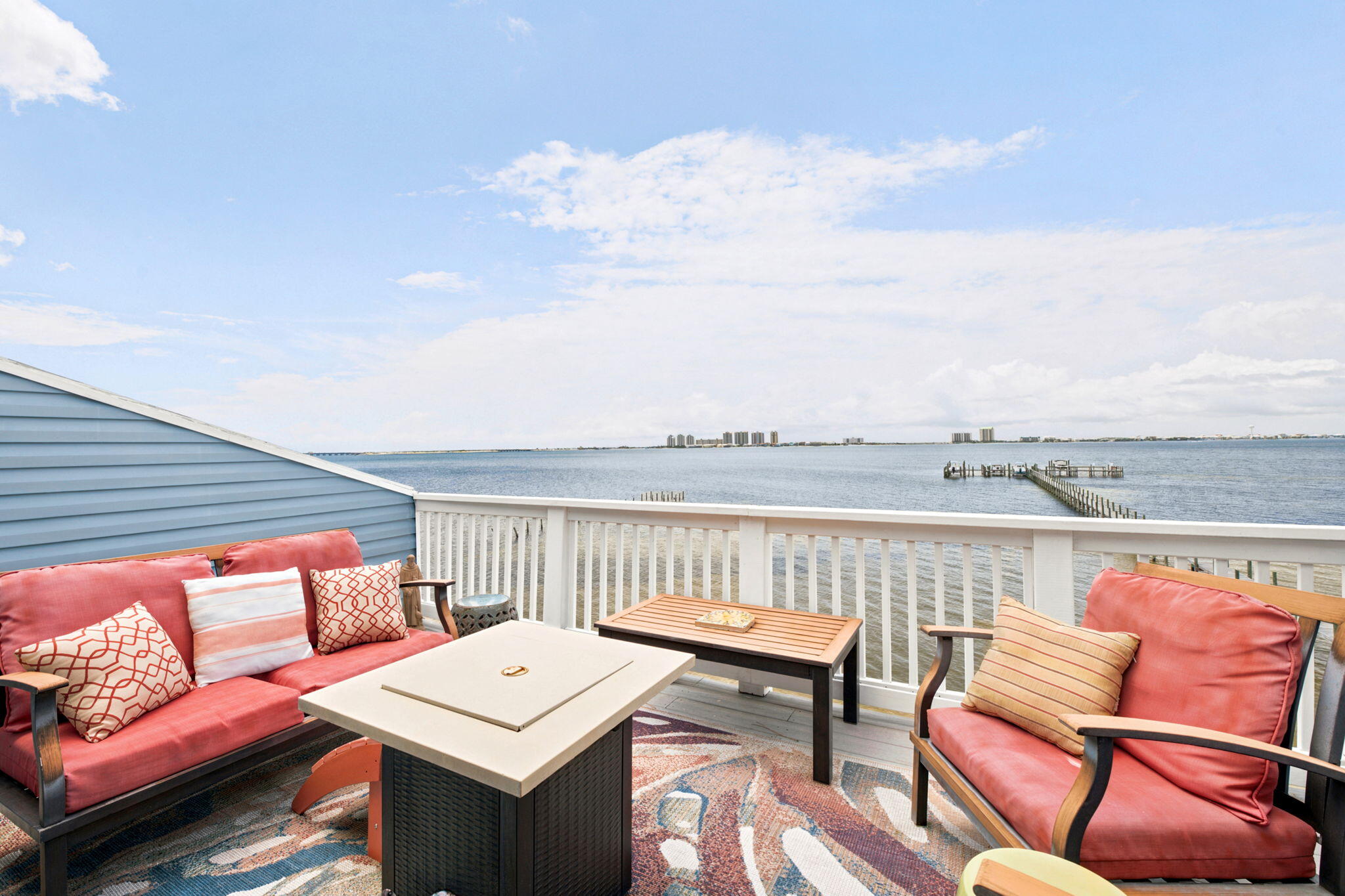 Waterfront townhomes with a deeded boat slip and views like this rarely come available here along the Emerald Coast.  Come see this beautifully maintained 2-bedroom, 2.5-bath townhome located directly on the Santa Rosa Sound in a gated waterfront community with only 13 residences. This 1,682-square-foot home features a spacious family room, a well-appointed kitchen, and two oversized bedrooms, each with its own private ensuite bathroom. Step onto the balcony and take in breathtaking views of the Santa Rosa Sound with a direct view of Navarre Beach across the water. Boaters will appreciate the deeded boat slip that can accommodate a boat up to approximately 24 feet, providing easy access to some of the area's best fishing and boating. The roof was replaced in 2022, and the HOA covers lawn maintenance, the community pool, pier and dock maintenance, trash service, minor exterior building repairs, and fiber high speed internet service.  Underneath the home you'll find a fantastic shaded entertaining area that's perfect for relaxing after a day on the water, along with a storage space for kayaks, paddleboards, fishing gear, and other beach toys. As an added bonus, the finished attic is currently used as a flex space and provides additional usable area not included in the square footage. Conveniently located near the Navarre Bridge, you'll be close to shopping, restaurants, and only two short miles from beautiful Navarre Beach. Make your appointment today to see this rare property!