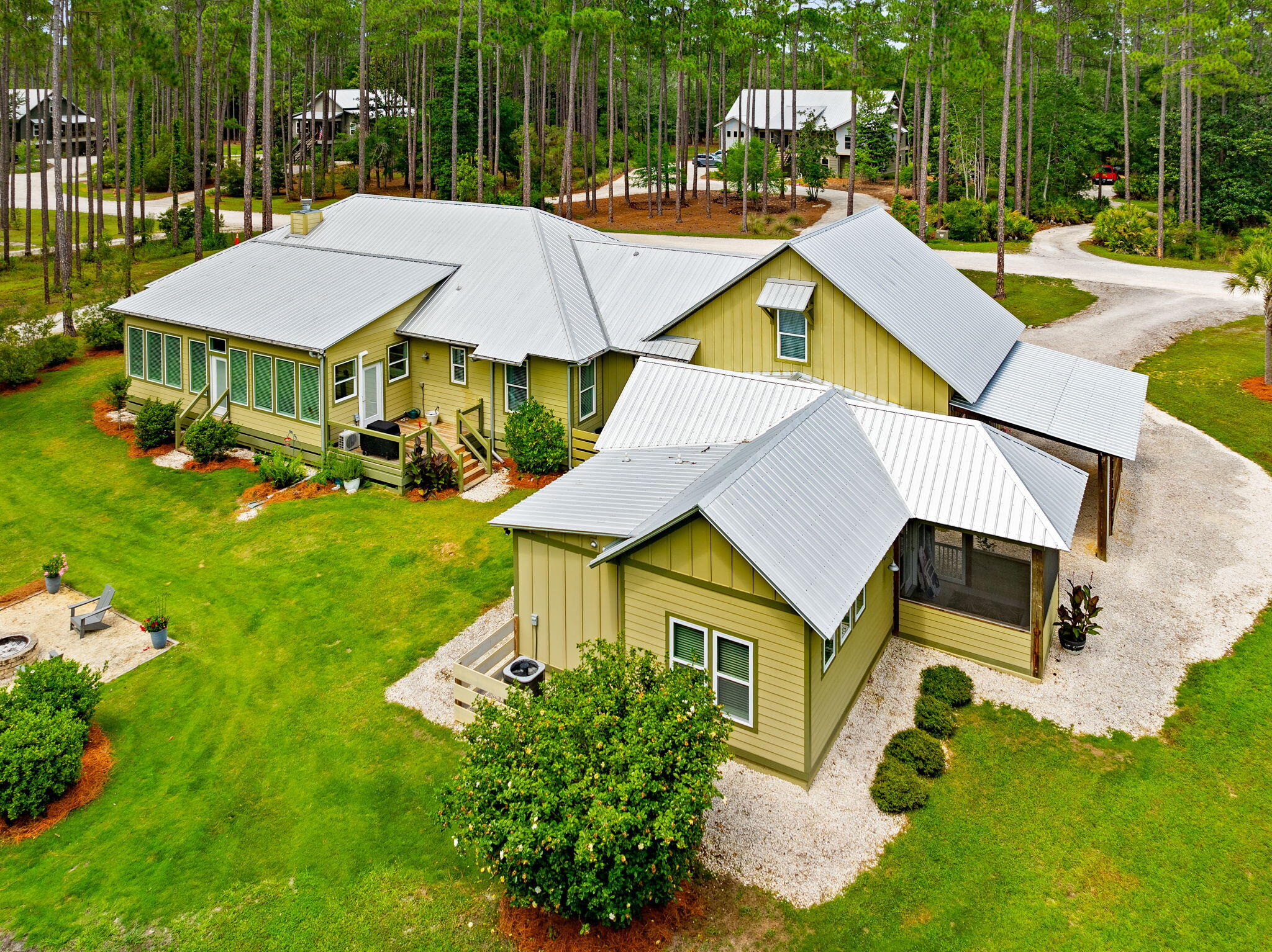 6408 River Bluff Trail is a custom built home that offers elegant single-story living in the prominent community of RiverCamps on Crooked Creek. This home offers a spacious 3,384 square feet of heated and cooled living space. Included in this square footage is a guest house for multi generational living, a bonus room above garage that includes a half bath, and a four Seasons room that is perfect for watching wildlife. The main living space includes 2,079 square feet. Ceramic Tile floors are found throughout main living area, kitchen, bedrooms, and bathrooms. Bullnose-Edge Quartz countertops, and oversized kitchen island are found in the modern kitchen. A gorgeous wood burning fireplace with 100 year old hard pine mantel sits at the focus of the living room. 
This home boasts 8 foot entry and closet doors in the main living space. And features 10 foot ceilings throughout with cathedral ceiling in living room and kitchen. It also offers oversized two car garage with 10 foot ceilings and 8 foot entry doors. As well as 220 power in garage. There are two master suites in main living space. The primary master bathroom features a claw foot tub, and curb less walk in shower. A new HVAC was installed in main house in December 2025. 
The Four Seasons Room is adorned with full wall windows that are perfect for watching the neighborhood wildlife. It also features LVP flooring, and a Mini Split HVAC system.This home truly provides a rare opportunity with the inclusion of the guest house. The guest house which was built in 2022 features a master bedroom, and master bathroom with a curb less walk in shower. It also includes a living area and kitchen. Other key features include a dedicated car port, and screened in porch. 
This homesite offers usable outdoor space that includes a fire pit, and an outdoor shower. 
RiverCamps on Crooked Creek is a Certified Nature Preserve Community. The community offers resort style amenities. Amenities include gated access, a future river house, newly built community pool, boardwalks and trails, kayak and paddle boards, fitness center currently being built, as well as community boat ramp, and boat storage for residents. The home is within walking distance to additional boat dock on crooked creek. 
RiverCamps is in close proximity to many local businesses's. It is only 10 miles from Pier Park and the famous white sandy beaches. It's also 2 and a half miles from NW Florida Beaches International Airport. 3 and a half miles from Publix, to be opening soon. And approximately 5 miles to new hospital, to be opening in 2028. Furnishings are negotiable. Measurements approximate. All information is deemed reliable, but not guaranteed. Buyer to verify if important.
