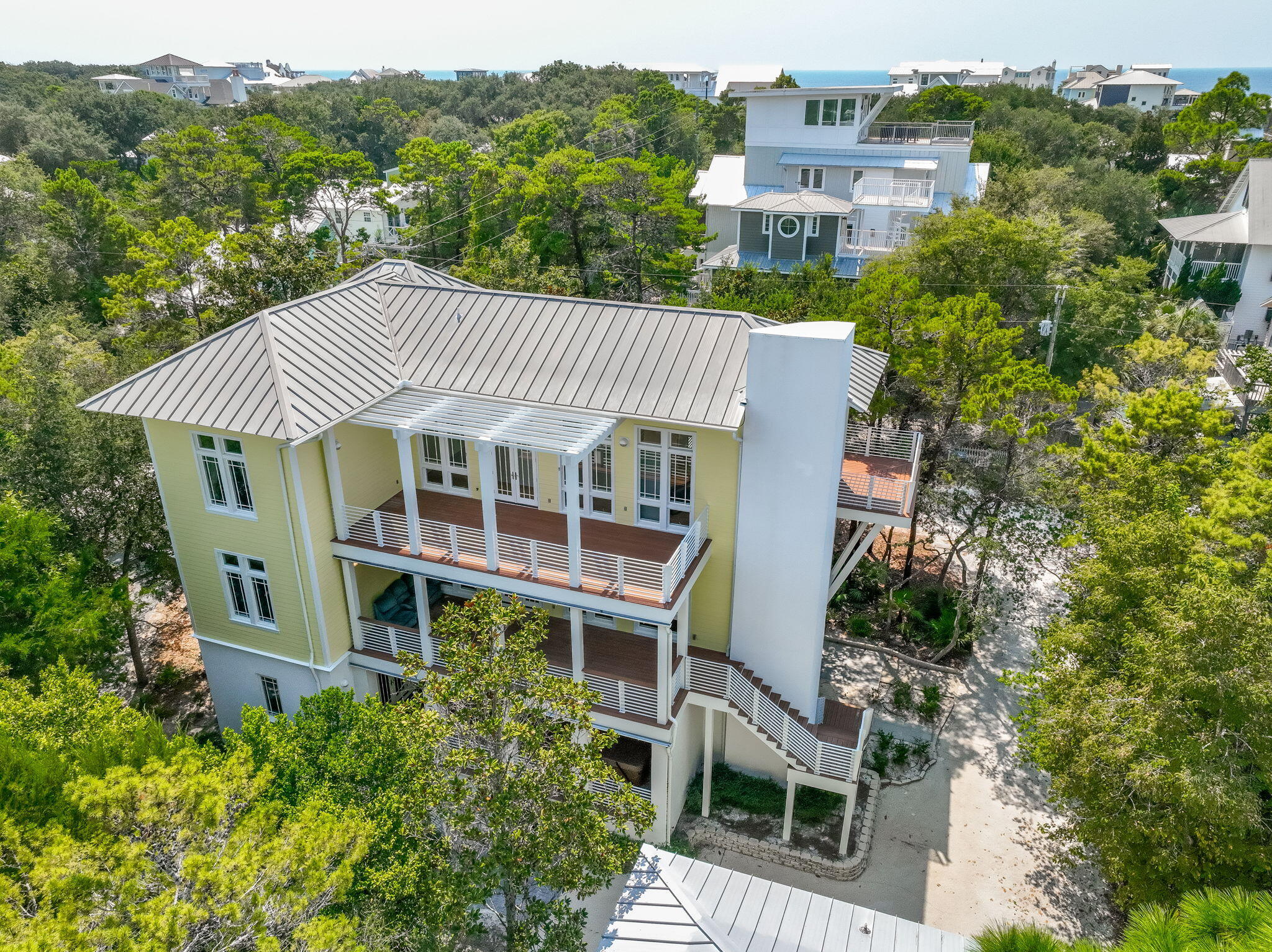 A Sanctuary Built with Love and Purpose in Seagrove Beach..
For many years, my late wife Linda and I dreamed of making the beautiful 30A area our permanent home.  In 2000, we found the perfect lot in Seagrove Beach--a quiet, idyllic spot just a short walk from both the shore and the vibrant heart of Seaside.  We knew instantly this was where we wanted to build our forever dream.
In 2004, we partnered with renowned local architect Tom Christ to bring our vision to life: a modern beach house flooded with natural light, designed to stand beautifully against the elements for generations to come.
-Engineered for Peace of Mind
-No detail was spared in making this home incredibly strong, resilient, and low-maintenance.
- Fortified Structure:  Built with a stucco and concrete block first floor, elevated 10 feet to eliminate stormwater concerns, and anchored by stainless steel cables running from the roof rafters directly into the concrete foundation.
- Premium Materials:  Clad in durable Hardie Board siding, fitted with hurricane-rated windows and doors, and topped with a long-lasting, wind-resistant standing-seam galvanized-aluminum roof.
- Salt-Air Protection:  Constructed using exclusively stainless steel exterior screws to prevent corrosion, alongside premium Trex decking on all porches so you can enjoy the Gulf breeze without the upkeep of painting or staining.
- Reliability:  Equipped with a whole-house natural gas generator to ensure uninterrupted comfort and power. *** A Home Designed for Living
Completed in 2006, the interior was a true labor of love. Linda spent months curating furniture and furnishings from across the Southeast, creating a space that felt both elevated and deeply welcoming.
It was designed to be lived in full-time. The layout features generous office space that comfortably accommodates two remote work setups, alongside a dedicated, quiet hobby room. For nearly two decades, this home provided us with a wonderful life. We spent our days walking to the beach for swims and sunsets, exploring local craft breweries and restaurants, and filling the rooms with the laughter of visiting friends and family.
-The Next Chapter
Following Linda's passing, this beautiful home holds too many memories for me to stay, but it remains a profound testament to the life and dreams we shared here. This house was built to be a sanctuary, a place of joy, and a bedrock for a beautiful life. My deepest hope is to pass it on to someone who will cherish the craftsmanship, embrace the incredible 30A lifestyle, and fill these walls with wonderful new memories of their own.

-On the first floor, you'll find a guest suite with private bath, walk-through laundry, and a massive unfinished flex space -- perfect for a future primary suite, media room, or game lounge.On the second floor, the open-concept living and dining area opens onto porches on both sides creating an ideal indoor-outdoor flow. A guest suite with a walk-in shower rounds out this level. The third floor is a private retreat: the primary suite stuns with wall-to-wall windows, a private balcony, dual closets, and a spa-worthy bath with double vanity, garden tub, and walk-in shower. Plus, there's a second guest room with pre-plumbing area ready for an ensuite bath Carriage House (781 sq-ft) 2 bedrooms, 1 bath and a full kitchen, perched above a 3-car garage, complete with a double car garage door on the left and single car garage on the right. A separate 11 x11 storage space. Ideal for multi-generational living, vacation guests, or rental opportunities. This Seagrove gem offers the best of both worlds smart, stylish architecture and unbeatable proximity to the Gulf and Seaside's vibrant hub.***Buyer is responsible for personally verifying details about this Any information contained in this listing is believed to be accurate but not guaranteed.***