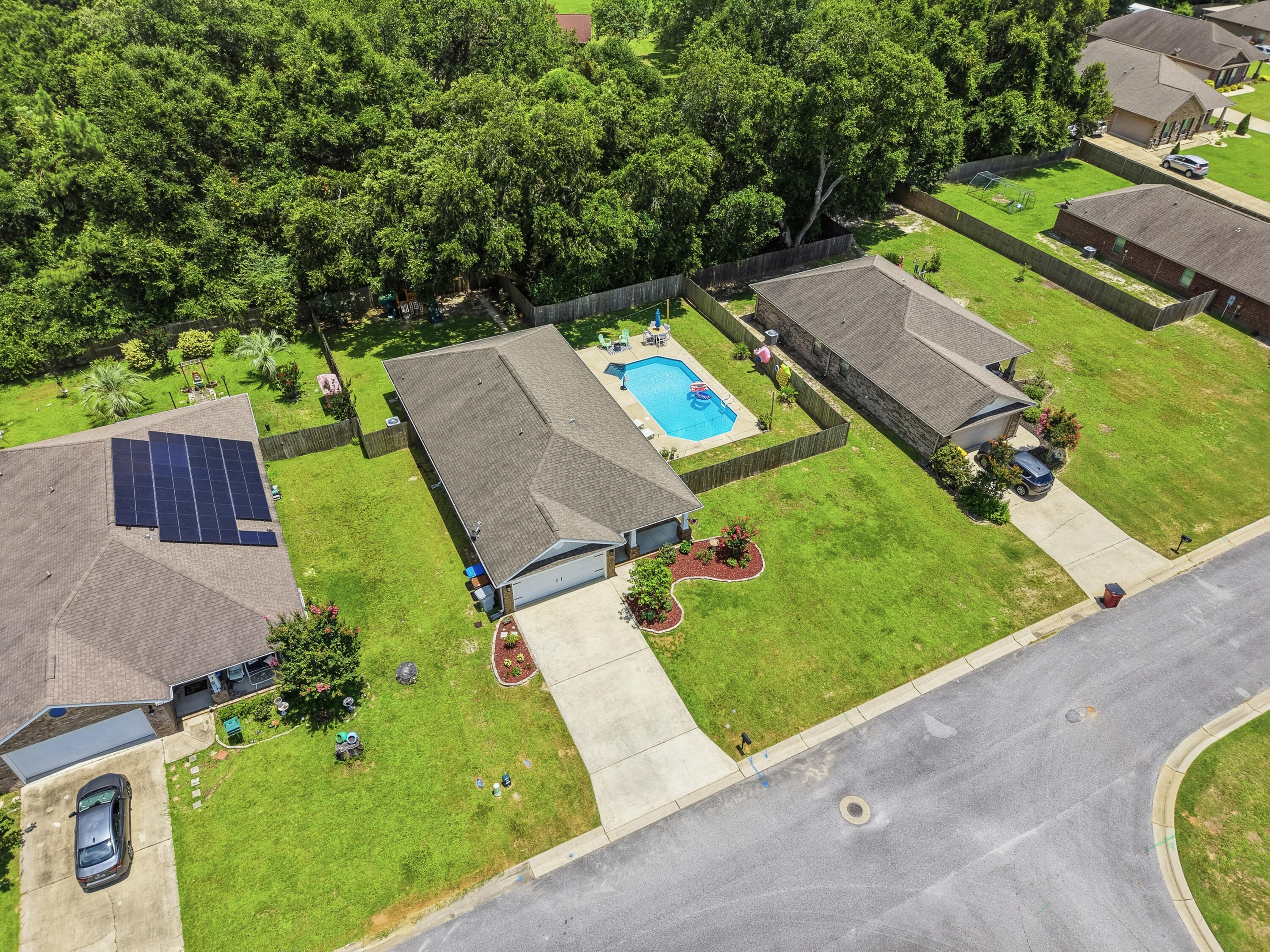 Welcome to this extraordinary 4-bedroom, 2-bath pool home located in the highly desirable Terra Bella subdivision and zoned for the sought-after new Wallace Lake K-8 School District. From the moment you arrive, the charming front porch creates a warm and welcoming first impression.

Step inside to an inviting foyer, where French doors open to a versatile flex room complete with a closet--perfect as a home office, study, fourth bedroom, playroom, or additional living space. The spacious kitchen is designed for both everyday living and entertaining, featuring light-colored countertops, stainless steel appliances, a large center island with a custom butcher block top, and a casual dining area. The kitchen flows seamlessly into the expansive great room, offering easy access to the backyard oasis.

The private primary suite is thoughtfully situated at the rear of the home, providing a peaceful retreat with an en-suite bathroom and separation from the additional bedrooms and full guest bath.

Step outside to enjoy the screened-in back porch overlooking your sparkling pool and private backyard--an ideal setting for relaxing, entertaining, and making the most of Florida's year-round sunshine. This exceptional home combines flexible living spaces, modern amenities, and an unbeatable outdoor retreat in one of the area's most desirable communities.