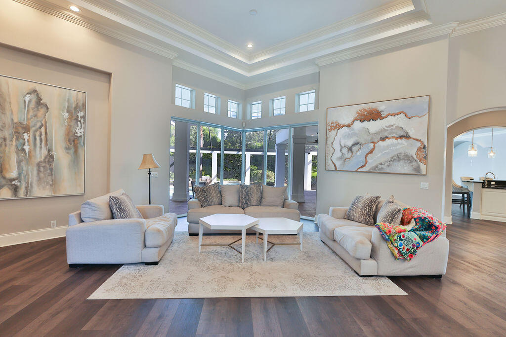 Set within the gated, impeccably maintained golf and lifestyle community of Kelly Plantation, this refined residence becomes more than a home--it is your private haven at the center of a complete luxury Florida lifestyle.
Here, days unfold with intention. Morning walks along manicured drives, afternoons on the award-winning golf course, time spent at the equestrian and tennis centers, and evenings winding down on your lanai with a glass of wine enjoying the light rumbling of the pool's waterfall. From your doorstep, the best of the Emerald Coast is effortlessly within reach
 
 --whether by golf cart or bike ride--connecting you to world-class shopping at Destin Commons, indulgent escapes at The Henderson Beach Resort & Spa, the sugar-white beaches of the Emerald Coast, and a vibrant collection of exceptional dining experiences.
Thoughtfully refreshed on both the interior and exterior, the home itself is designed to elevate every moment of that lifestyle. With five bedrooms, four-and-a-half baths, and a dedicated office with custom built-ins, it offers both scale and intimacy. The main level features a serene primary suite alongside a guest retreat, while expansive, light-filled living spaces flow seamlessly into a generous outdoor living area--ideal for entertaining, gathering, or simply enjoying quiet coastal evenings.
Inside, every space supports the way you want to live. A beautifully lit lanai sets the stage for intimate evenings, a versatile recreation or teen retreat creates room to unwind, and both formal and casual dining areas allow you to host with ease. The open floor plan carries natural light throughout, creating an atmosphere that feels both elevated and effortlessly comfortable.
Recent updates ensure a turnkey experience: a new roof, updated flooring throughout, freshly painted exterior, upgraded lighting, upgrade to gas tankless hot water heater, as well as recent replacements of some pool and hvac equipment.
This is a home designed not just to be lived in--but to be experienced. A place where you return from the beach, the course, or an evening out and gather with family, entertain with purpose, and enjoy life at its fullest--anchored by one of Destin's most sought-after communities.