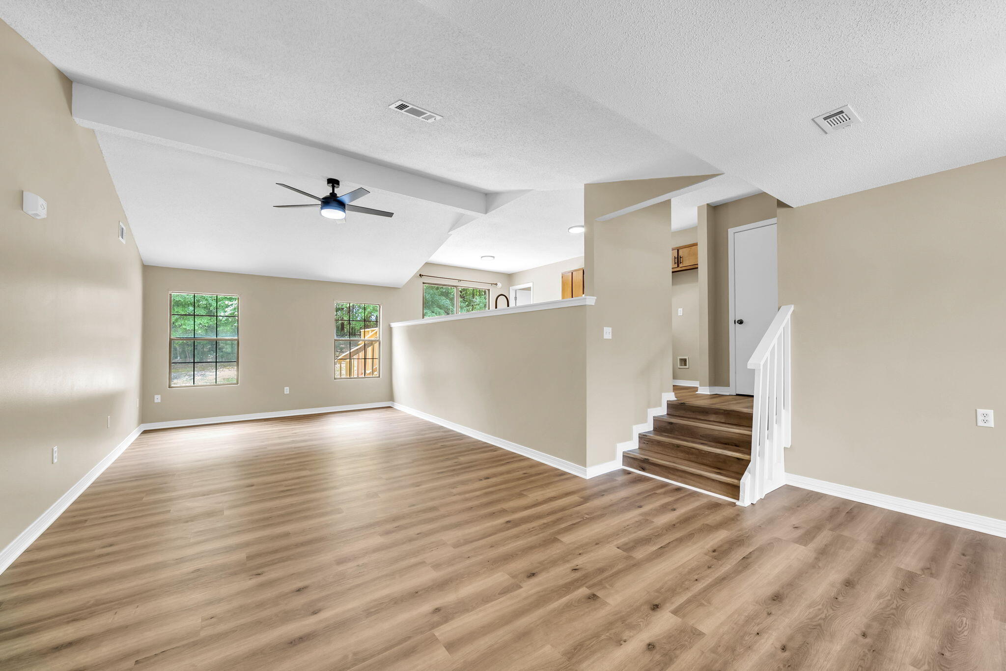 Seller offering $5000 towards closing costs. New LVP flooring throughout. New Quartz kitchen countertops. New water heater.  located at the end of Cul-de-sac on large lot backing up to woods.