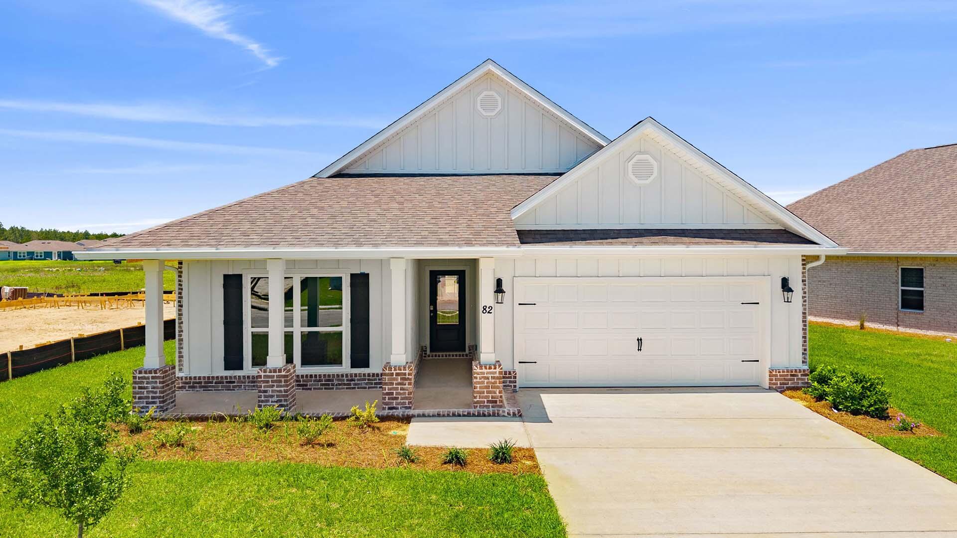 Welcome to the 82 Gray Owl Drive E, a new home at Owl's Head Farms in Freeport, Florida. This home has a large covered front porch.  The front entry hallway leads to a light-filled open-concept living area with 9' ceilings. The kitchen impresses with quartz countertops, undermount single basin sink and a dedicated water filter faucet. stainless steel appliances, and a large center island with bar seating overlooks the great room. Brushed nickel fixtures are throughout the home and include a lifetime warranty.  Adjacent to the kitchen is the dining area perfectly positioned for meals and gatherings, while the living room's wide layout invites relaxation and socializing.
