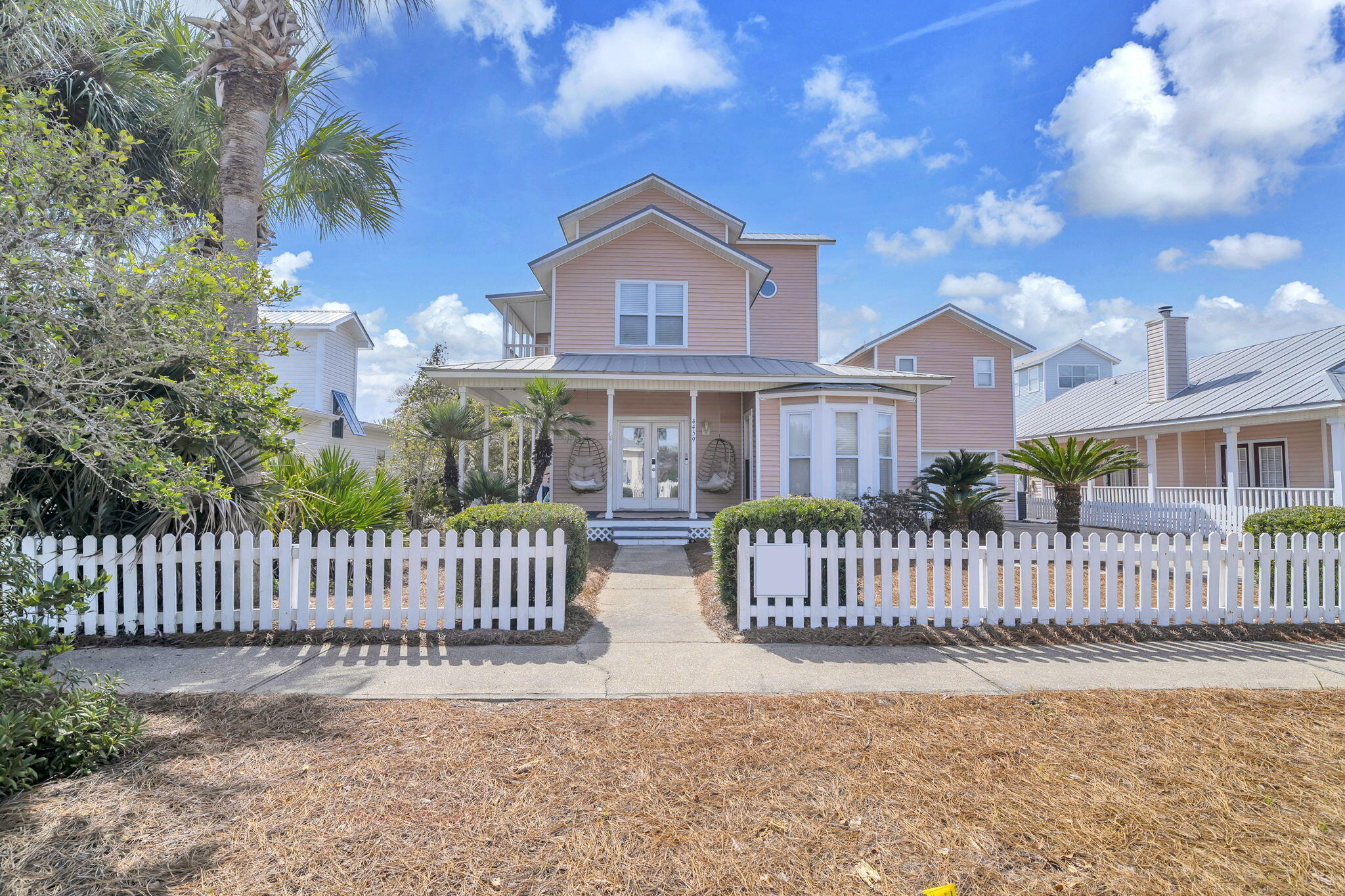 Welcome to Opal Beach House, a beautifully maintained 5-bedroom, 4.5-bath coastal retreat located in the desirable Crystal Beach Cottages community. Designed for both relaxation and strong rental performance, this exceptional property offers the ideal blend of comfort, style, and investment potential. The outdoor living space is truly a highlight. The private heated pool anchors a spacious backyard oasis, surrounded by expansive deck space that provides plenty of room for lounging, sunbathing, and outdoor dining. Whether hosting a group getaway or enjoying a peaceful evening swim, the layout accommodates both large gatherings and quiet moments. A covered patio bar area with mounted TV creates the ultimate outdoor entertainment zone. Perfect for game days, evening cocktails, or relaxing  poolside with your favorite show, this shaded space adds a resort-style feel that guests love. In addition to the home's private amenities, owners and guests also enjoy access to the Crystal Beach Cottages community pool, offering even more room to unwind. The property also features a separate carriage house, providing added privacy and flexibility. The carriage house includes a garage converted into a dedicated game area, delivering a fun, engaging space that enhances the guest experience and boosts rental appeal.Inside, the home offers spacious, well-appointed living areas with stylish coastal finishes and a thoughtful floor plan that comfortably accommodates multiple families or groups. As a top self-managed rental producer, Opal Beach House has a proven history of impressive returns. With its standout outdoor entertaining spaces, desirable location, and guest-focused amenities, this property presents a rare opportunity to own a high-performing vacation home that doubles as your own private beach retreat.