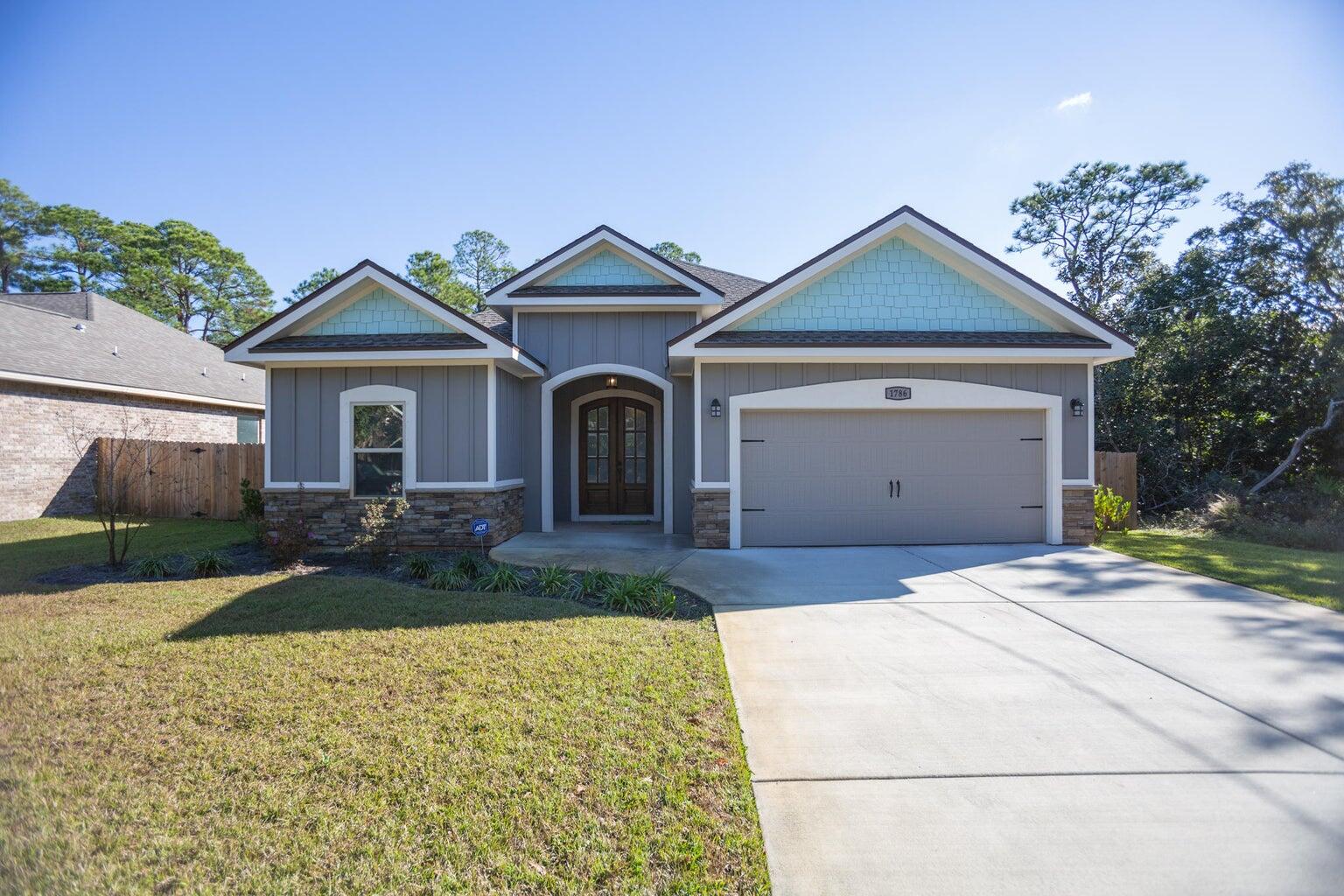 Come see this beautiful turnkey home in Navarre just minutes from the water. Built in 2017, enjoy modern features that have been meticulously maintained. Notice custom touches throughout such as cabinets, flooring, and counters. The open concept living area makes the perfect spot for hosting/entertaining. Step out back to enjoy a covered patio. Don't miss this one!