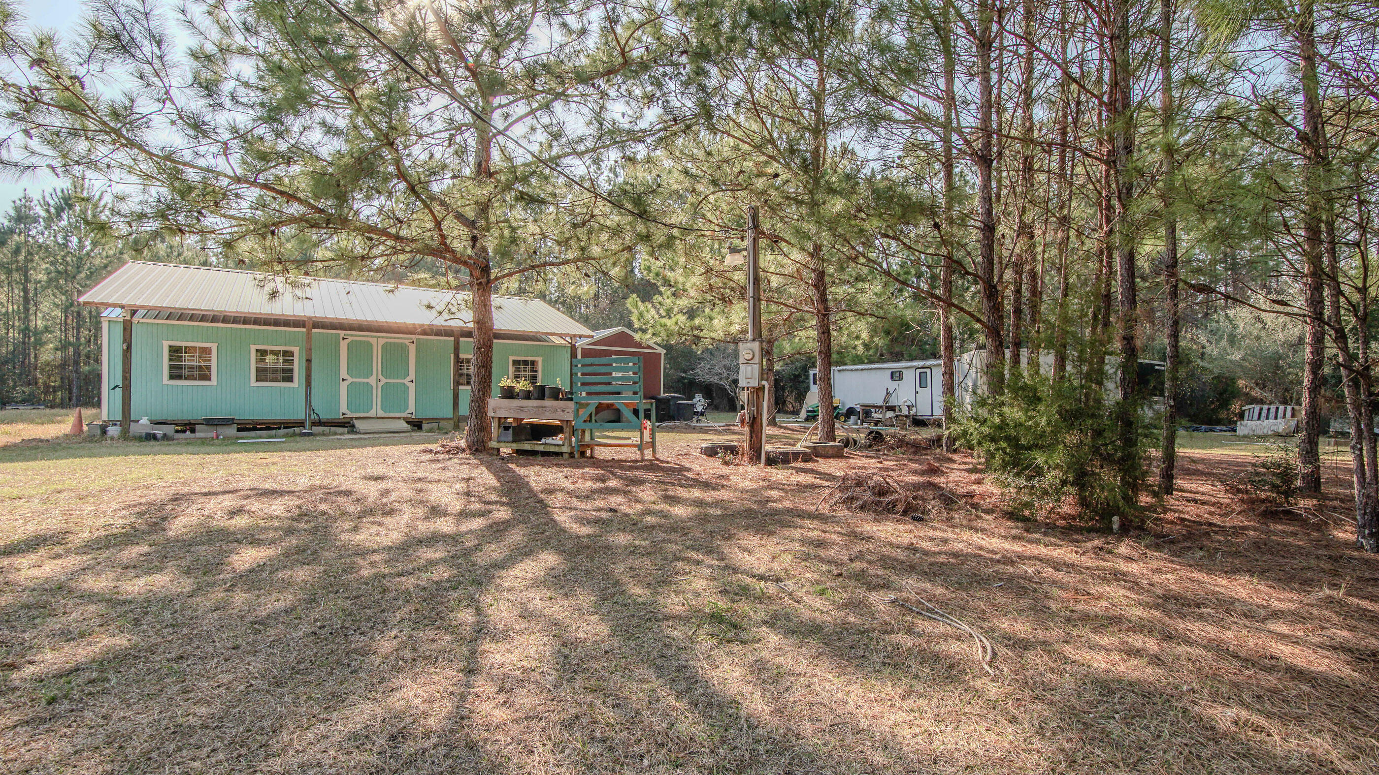 Ready to build something awesome? This Ponce De Leon property is just waiting for your imagination to make this your dream property. Located in the peace and quiet of Ponce de Leon, you'll find a 30x36 pole barn with a new, wired and insulated 16x40 shed mostly tucked underneath, adjacent to a wired 12X32 shed, a recently installed 1100-gallon septic tank, and a well already in place sitting on 1 acre. The whole property is fenced and ready to go. Looking for a weekend tiny home retreat getaway? DeFuniak Springs is just minutes away, and Santa Rosa Beach is about a 45-minute drive. Vortex Spring is roughly fifteen minutes down the road, and Morrison Springs is only about 20 minutes away, perfect for outdoor recreation. Come check it out and start relaxing or build your dream home here!