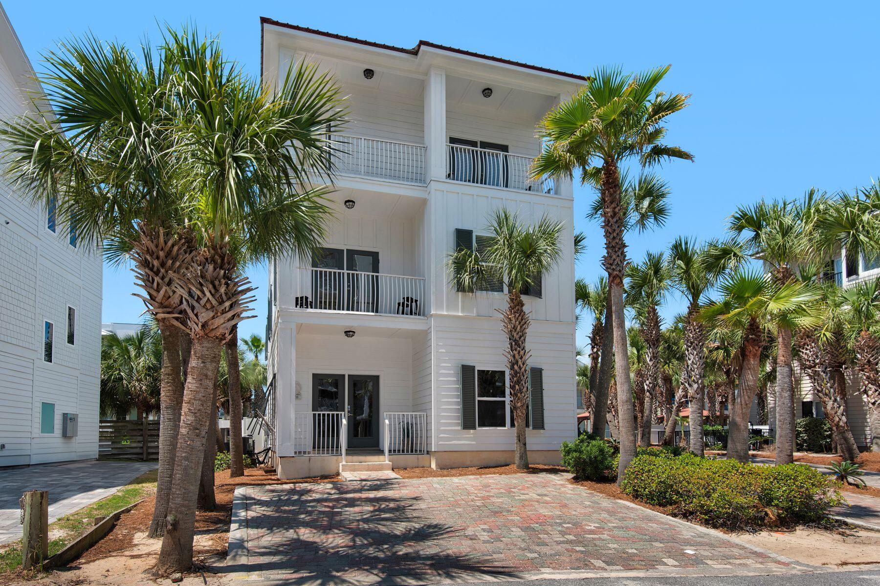 Just two lots from the sand, this gulfside oasis offers a rare opportunity to own a high-performing coastal retreat with no HOA and prime proximity to beach access. This six-bedroom, seven-and-a-half-bath home spans three well-appointed stories and is projected to generate approximately $160,000 annually even with owner use making it a compelling investment and personal getaway in one.

The main level features a bright, open-concept living area, a full bath, and a convenient guest bedroom. A second living room on the second floor provides additional gathering space, while the true primary suite occupies the third level with added privacy and partial gulf views.