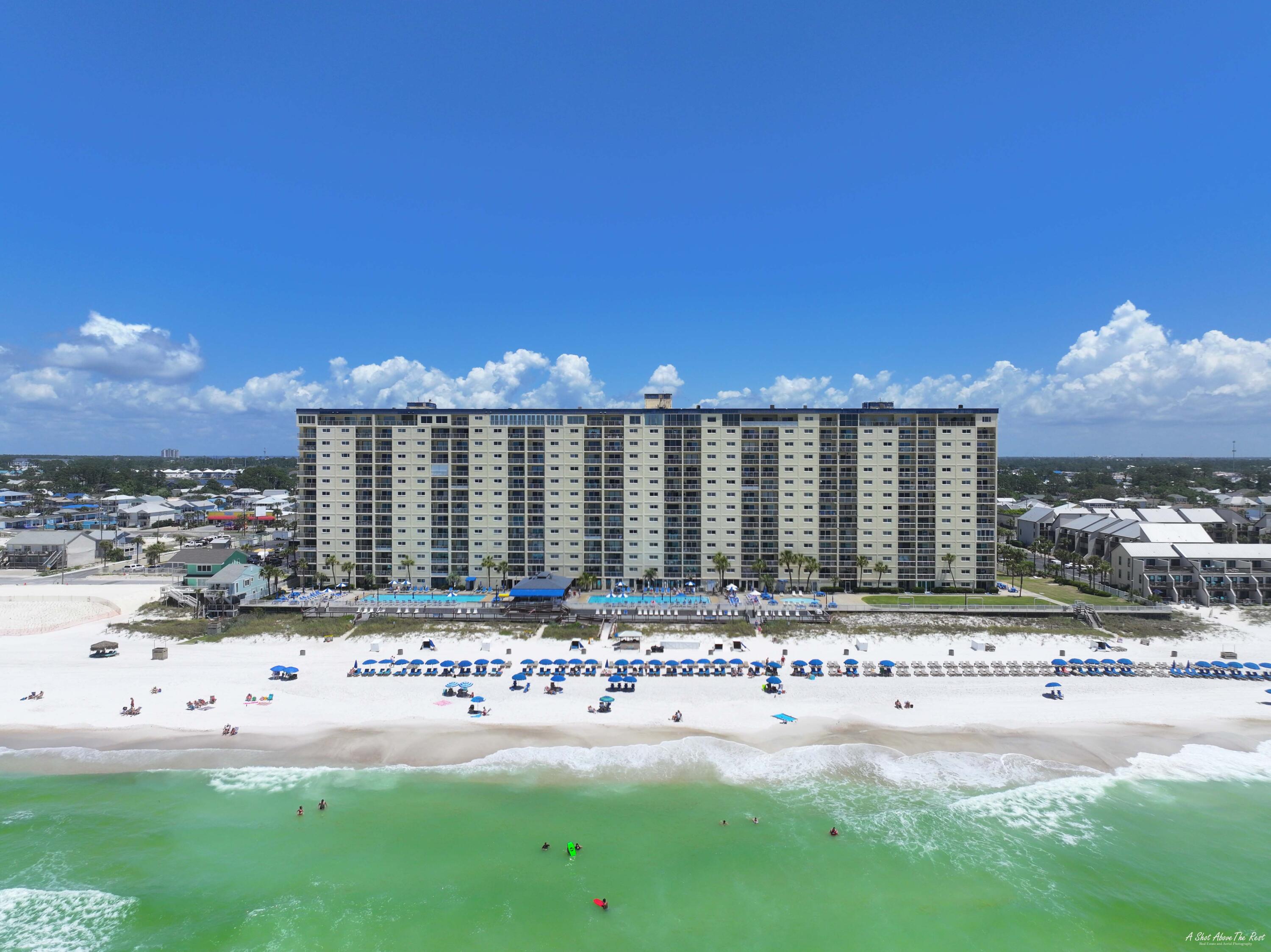 Welcome to Regency Towers Condo unit 611, a captivating gem in Panama City Beach.  This immaculate 2-bedroom, 2-bath unit is a turnkey vacation rental, perfect for investors and beach lovers alike. Professionally renovated, this condo exudes coastal charm including new sliding glass doors in the living room and master bedroom, granite countertops, LVP flooring, and both bathrooms. The coastal décor and beachy furnishings further enhance the beachside ambiance, providing a true retreat for vacationers. Situated on the coveted 6th floor, this unit offers stunning beachfront views from the living room and master bedroom. The gated security of Regency Towers ensures privacy and tranquility Amenities include two large pools, a tiki bar, hot tub, tennis courts, shuffleboard, and exercise room