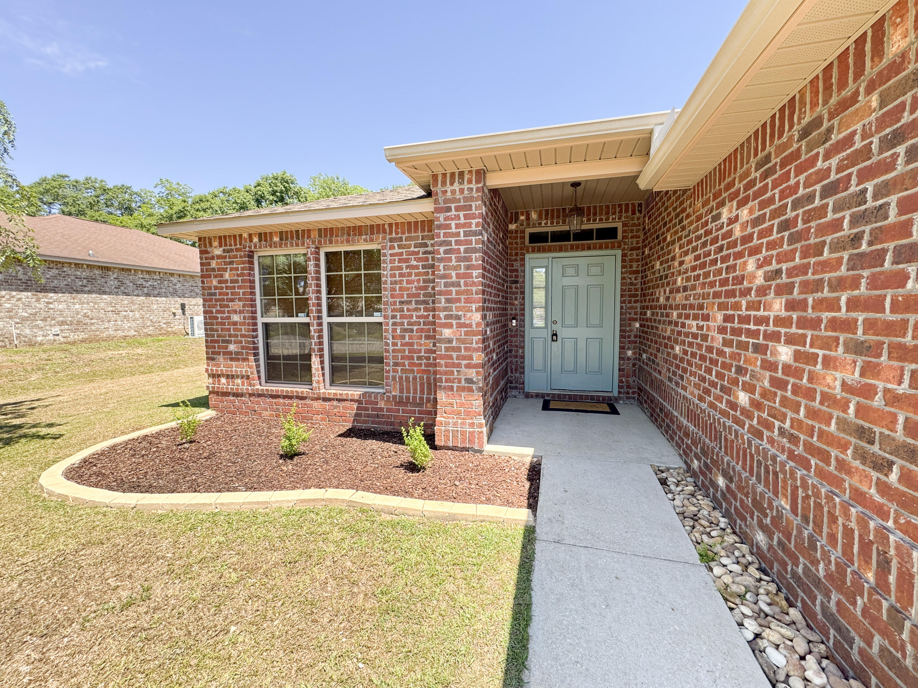 Price Improvement -- now positioned to compete! All-brick 3BR/2BA home on a .36-acre fenced lot in Baker, FL with NO HOA. If you've been watching this home, now is the time to take a second look. Offering 1,922 square feet and a two-car garage, this move-in-ready home delivers features you won't always find in nearby new construction -- including an established neighborhood, larger lot, and fully fenced yard.Inside, enjoy an open floor plan with luxury vinyl flooring in the main living areas. The kitchen features granite countertops, stainless steel appliances, a wrap-around breakfast bar, walk-in pantry, and separate laundry room. The private primary suite includes double doors, a large walk-in closet, dual-sink vanity, soaking tub, and separate shower. Two additional bedrooms and a full bath provide flexible space for family or guests. Step outside to a covered back porch and spacious backyard -- ideal for pets, play, or relaxing evenings. Conveniently located near Baker School with easy access to military bases, shopping, and main commute routes. Schedule your showing today -- this new price creates a strong opportunity in today's market.