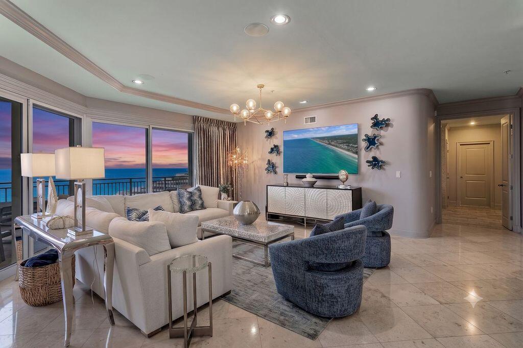 Discover an exceptional Gulf-front retreat in this stunning 10th-floor east-end villa at Grand Dunes II, where sweeping views of South Walton's emerald waters and sugar-white beaches await you! Designed with contemporary-chic interiors by a renowned local designer, this 4-bedroom, 4-bath residence offers 3,030 square feet of beautifully appointed living space and is among the largest villas in the complex. From the moment you arrive through the private foyer, the home reflects thoughtful design, elevated finishes, and an uncompromising attention to detail.
The open-concept gourmet kitchen is designed for both effortless entertainment and refined daily living. It features top-of-the-line stainless steel appliances, a five-burner natural gas cooktop, double ovens, an icemaker, custom granite countertops, and custom cabinetry enhanced with upgraded hardware. Throughout the villa, 9.5-foot ceilings, curated artwork, wallpaper accents, designer lighting, and custom draperies create a sophisticated coastal atmosphere. The living area includes an 85-inch HD TV with Sonos surround sound, while each bedroom is thoughtfully finished with custom bedding, draperies, and flooring.  Additional features include travertine floors in the foyer, living area, dining room, kitchen, and baths; custom area rugs; and a central vacuum system for added convenience. The Primary Suite offers a serene Gulf-front escape with an 8-foot interior door, expansive water views, a comfortable seating area, his-and-her walk-in closets, custom flooring, and elegant furnishings and accessories. The fully renovated primary bath is equally impressive, featuring a soaking tub beneath a designer chandelier with an arctic ledger tile surround, a separate dual-head shower, custom soft-close vanities, VitrA porcelain sinks, custom flooring, and a private water closet.
Outdoors, the oversized Gulf-front balcony expands the living space with more than 350 square feet for relaxing, dining, or entertaining. Beautiful furnishings, a built-in natural gas grill, and hurricane shutters make this spacious balcony both inviting and practical.
Grand Dunes provides an outstanding collection of resort-style amenities, including gated entry with 24-hour security, lush landscaping, three levels of gated underground owner parking, a grand lobby, semi-private elevators to your private foyer, a private heated pool and hot tub, an owner's lounge with a Gulf-front fitness room, overflow suites for guests, 200 feet of deeded beach, a majestic waterfall, and a lagoon-style Gulf-front pool area with a hot tub shared by both buildings, plus beach service. 
This tranquil Gulf-front oasis, offered turnkey with only a few personal items excluded, delivers a rare combination of privacy, design, and resort-style living in one of South Walton's premier beachfront communities.