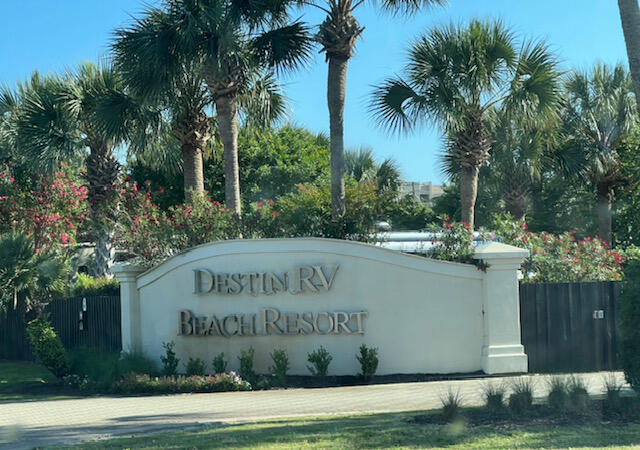This is a rare opportunity to OWN A LOT at DESTIN BEACH RV RESORT. Spaces rarely come up for sale at this luxury 36 space RV Resort directly across the street from one of the most beautiful sugar white sand beaches in the entire world. AMENTIES OF THE PARK INCLUDE private beach access, heated pool, designer paver streets, lush tropical landscaping and landscape lighting, gated entry, owners room, heated and cooled bath house and laundry facility, on site guest condo rentals. This RV Resort allows you to rent your lot within the rental management program that the HOA has established and this lot has an EXCELLENT RENTAL HISTORY which is estimated to gross approximately $30,000 this year so as an investor at the $298,500 price you would be looking at a return of likely around 5% after expenses plus the appreciation of the property and being able to use it. This is a good option for 1031 exchange buyers as well looking to park funds in an appreciating and cash flowing asset. 

HOA dues of $403/month include water, Wi-Fi and garbage services and all of the other amenities listed above. Enjoy the best of both worlds as an investment property that pays for itself while using it for family getaway vacations to one of the most beautiful beaches in the world.

This RV Park not only has walk over or golf cart ride over to the beach access but it is conveniently walking distance to many fun local restaurants like Surf Hut and Whales tail as well as the Embassy Suites hotel that is adjacent to the RV park. This RV park accepts RV's over 25ft including Class A, B, C motorhomes and travel trailers as well as 5th wheels. There are not many condo RV parks that allow rentals which cover expenses and there are also not many RV parks that you can own a space that are this close to the beach.  MAKE LOT #22 YOURS TODAY!
