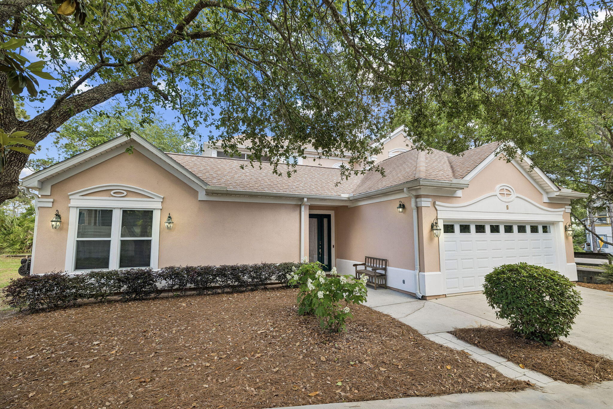 Tucked away in a secluded setting, this impressive three-bedroom, three-bathroom residence provides a distinctive blend of privacy and beauty within Fairway Villas. Known for mature, lush landscapes, short-term rentals are not permitted, ensuring a peaceful environment. Residents enjoy a convenient location that places them within easy walking distance of three beach access points, the scenic causeway spanning Oyster Lake, and a variety of nearby restaurants.

Adjacent to the third fairway of Santa Rosa Golf Club, the home enjoys tranquil views of the golf course. The setting creates a serene atmosphere that is both private and welcoming, making it an ideal retreat within the community.

Thoughtfully expanded and renovated, the home is designed for comfort, everyday living, and entertaining. The 10-foot-high ceilings are highlighted by crown molding throughout the downstairs area, while wide archways contribute to a spacious and inviting atmosphere.

The living room serves as the heart of the home, featuring an elegant, mantled gas fireplace, abundant natural lighting, and multiple seating arrangements, creating a warm yet open concept for socializing.

The remodeled kitchen blends style with an efficient layout, which includes expanded counter space, quartz countertops and backsplash, a dual-gas range, and a large porcelain sink with a separate prep sink. Adjacent to the kitchen is a spacious dining room with double French doors opening to the patio, a dedicated office area and laundry room with utility sink. 

The expanded primary suite offers generous space, a private sitting area, two walk-in closets, an additional storage closet, and a fully remodeled spa-inspired bathroom featuring double vanity sinks, a walk-in shower and a large step-in soaking tub.

Upstairs, the enhanced second-floor layout offers versatility and additional indoor-outdoor living. This spacious activity room is a transition area connecting a 10'x13' screened deck overlooking the golf course on one side and on the other side is a bedroom with ensuite bath and double sinks. Outdoors living on the main floor are equally impressive with a 16'x25' screened patio, tiled floor and views of a peaceful small park setting as well as a peek of the golf course. 

The spacious downstairs bedroom offers direct access to the patio, abundant natural light and the convenience of a full hall bathroom. 

Additional highlights include extensive storage closets, a wide double garage with extra parking and an outdoor shower located beside a private screened tiled area on the east side of the home with gated access to Allen Loop, providing extra parking for a golf cart or other vehicle. The community provides a heated and chilled pool in a lovely setting conducive to relaxation and sociability.
This home offers a rare combination of privacy and convenience.
Thoughtfully designed indoor and outdoor spaces further elevate the lifestyle, making this one-of-a-kind property a true representation of the Santa Rosa Beach lifestyle.

All information is believed to be accurate but should be verified.