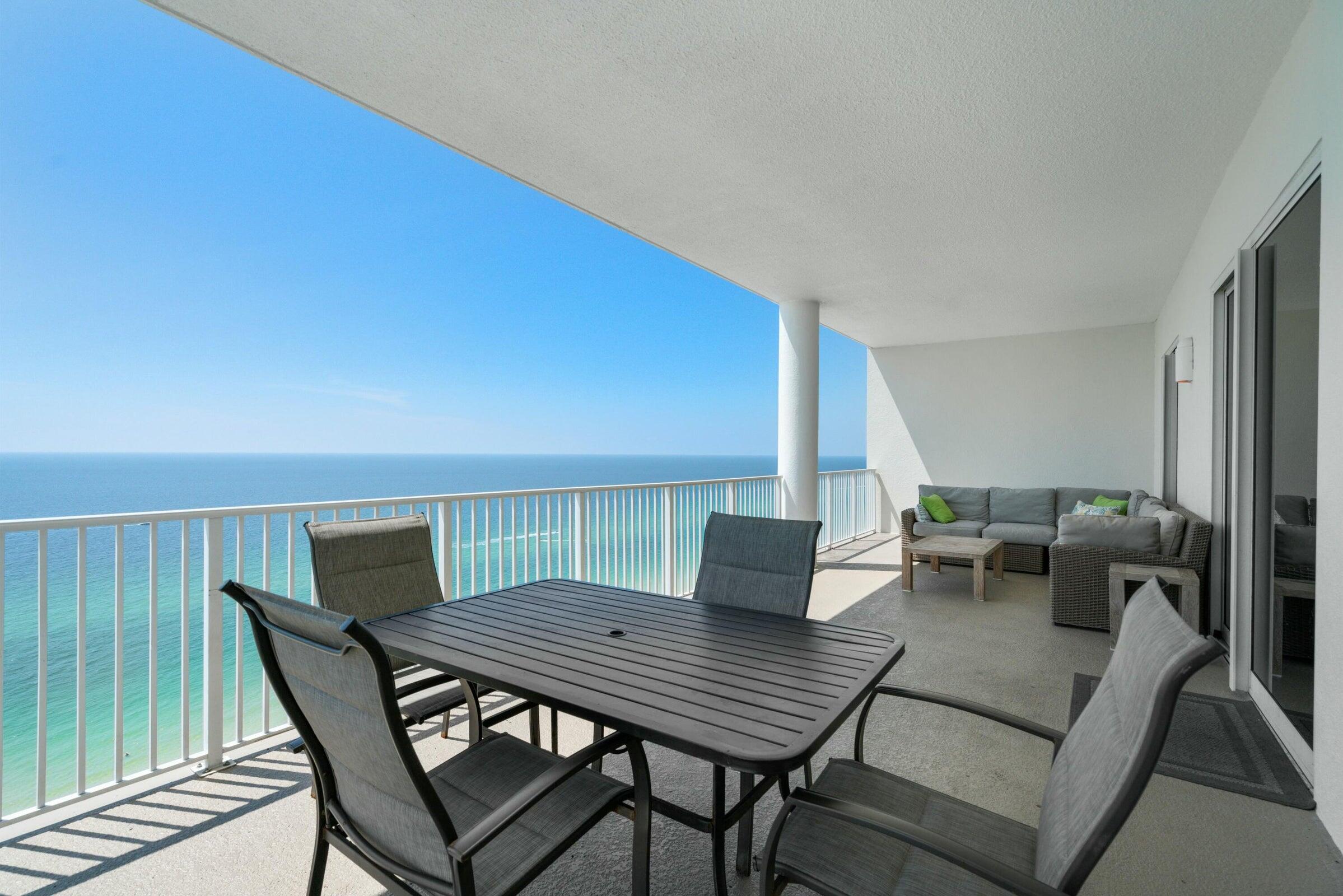 Ocean Ritz 2001 offers the ultimate Gulf-front retreat with 4 bedrooms, 4 full bathrooms, including 2 Gulf-front primary suites, and an expansive 12.5' x 40' balcony designed to maximize the breathtaking Emerald Coast views. The living room and both Gulf-front primary bedrooms open directly to the oversized balcony through stunning floor-to-ceiling sliding glass doors, creating seamless indoor-outdoor living and filling the space with natural light and panoramic Gulf views. This beautifully maintained condo includes a highly desirable assigned covered parking space. Ocean Ritz amenities include a Gulf-front pool, hot tub, fitness center, sauna, and steam room. Conveniently located near Pier Park, Shipwreck Island Waterpark, and St. Andrews State Park, this spacious beachfront condo is ideal as a primary residence, second home, or investment property - offering luxury, comfort, and convenience in the heart of Panama City Beach.