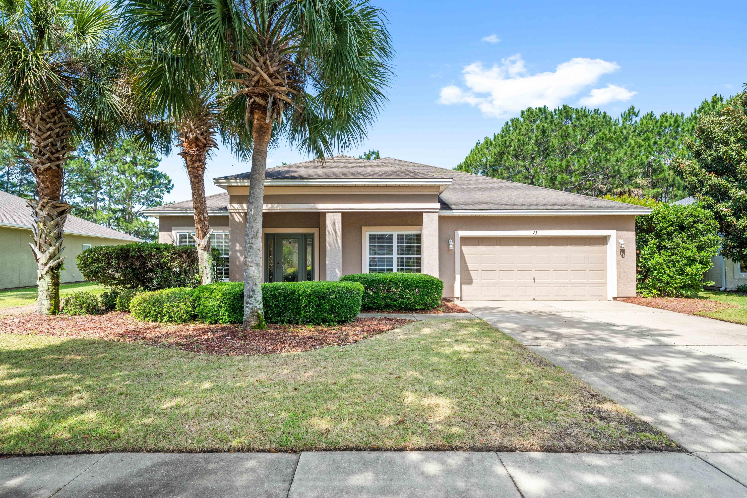 4BR/2.5BA ranch home in Palmetto Trace with pond frontage, community pool access, and a convenient Panama City Beach location near shopping, dining, and the beach. Built in 2006, this single-level home offers approximately 2,425 square feet under roof with an open living area, tile flooring throughout with carpted bedrooms, crown molding, 9 foot ceilings, and abundant natural light. Carpet just replaced in the bedroom staged as an office. The kitchen features a breakfast bar, pantry, and included appliances. The primary suite includes a walk-in closet and double vanity bath. Enjoy a covered patio, spacious backyard with pond views, and a 2-car attached garage. Palmetto Trace amenities include a community pool and sidewalks throughout the neighborhood.